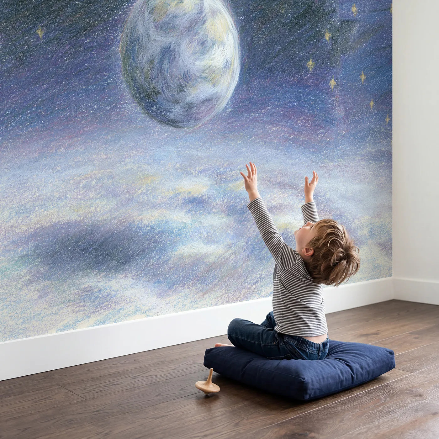 Child in nursery with Gentle Planet Earth Wallpaper Mural by Whimsy Tots