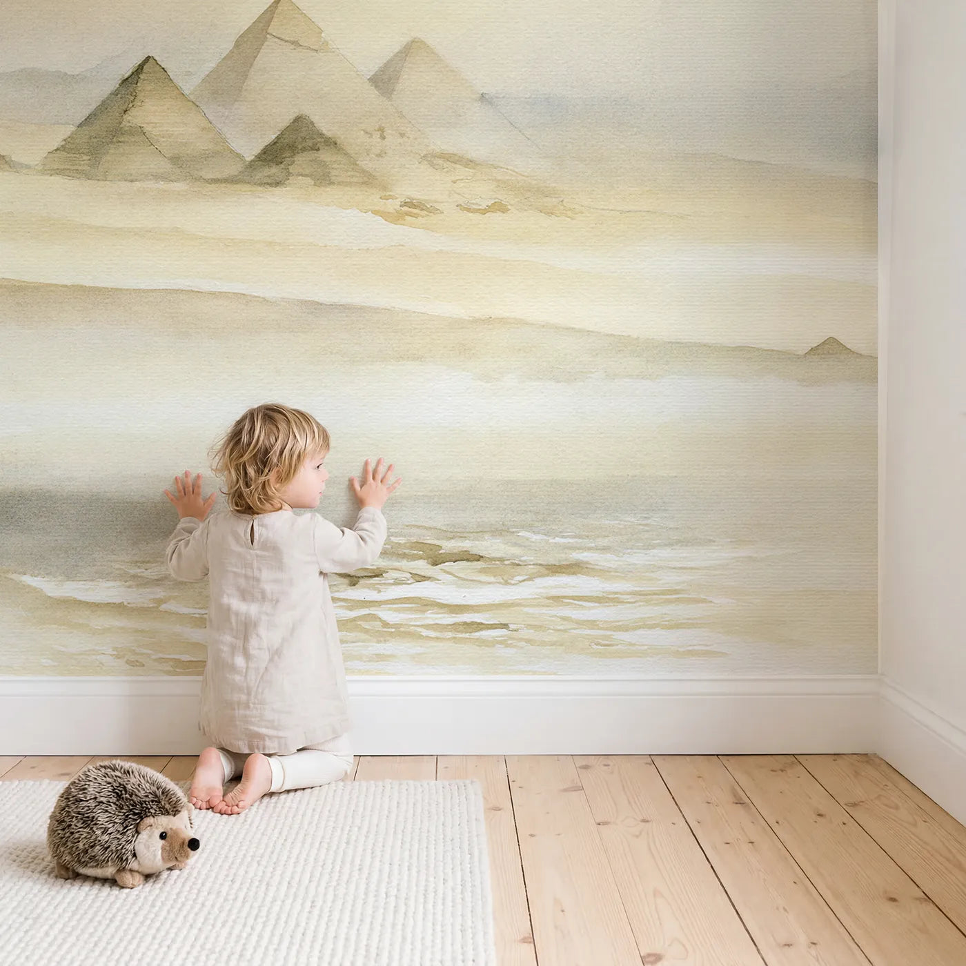 Child in nursery with Hazy Desert Pyramids Wallpaper Mural by Whimsy Tots