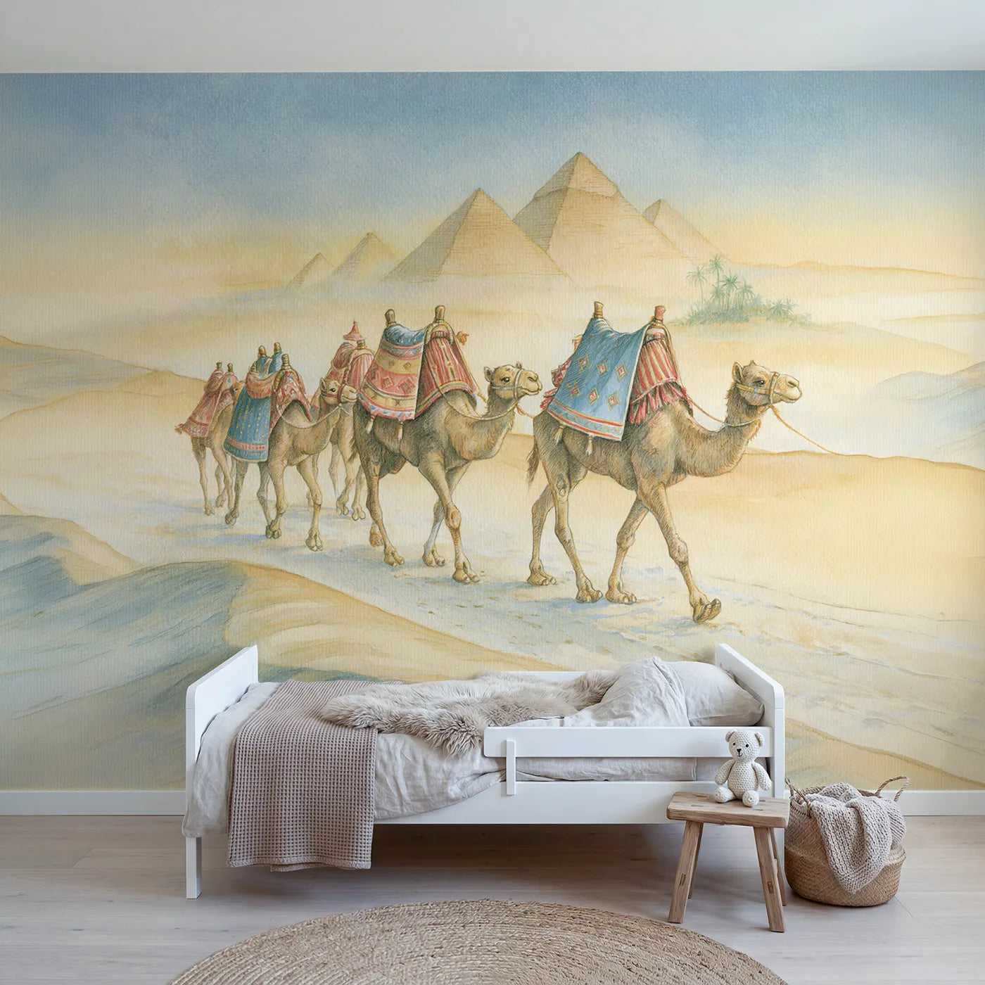 Storybook wall mural of a camel caravan at dusk by Whimsy Tots