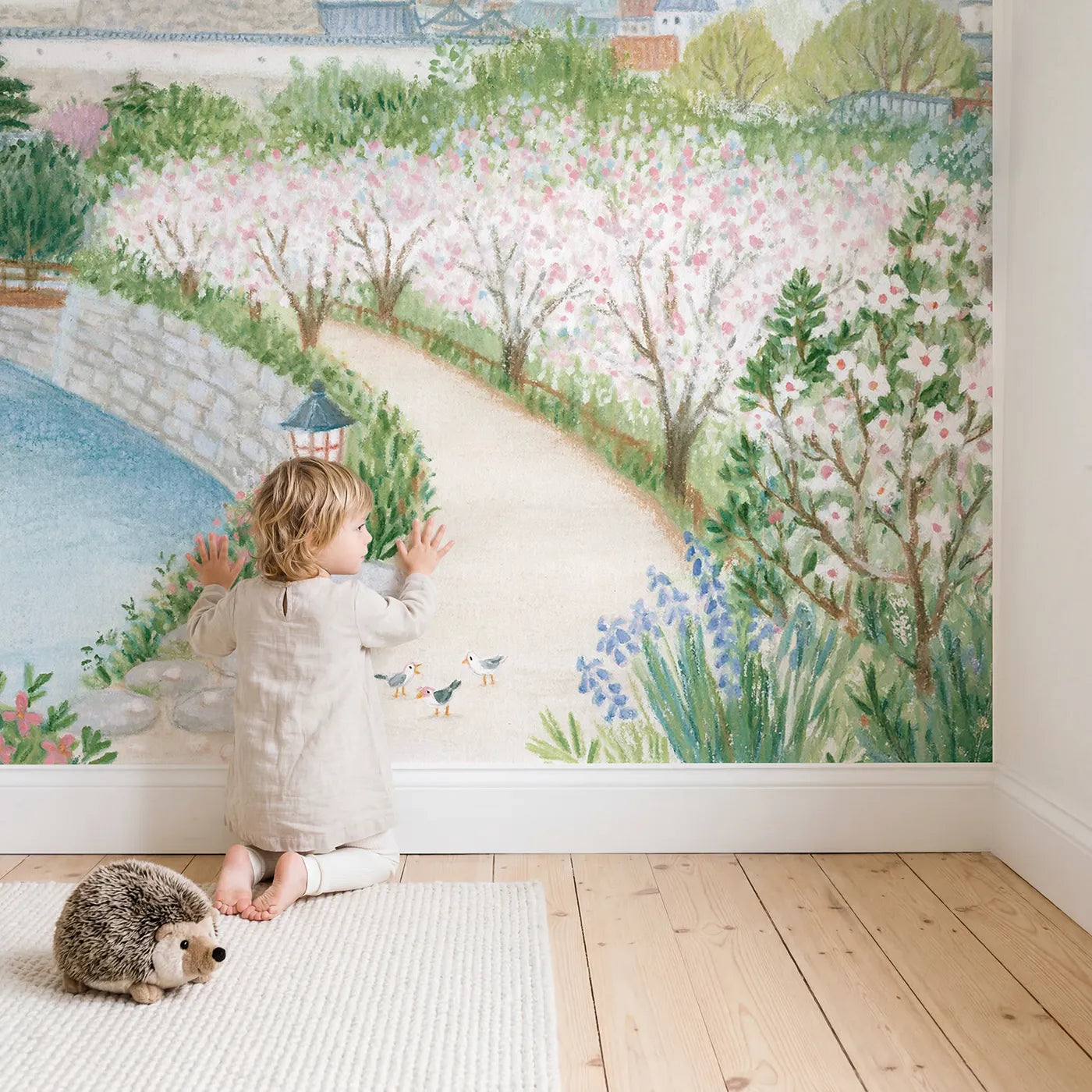 Child in nursery with The White Heron Castle Wallpaper Mural by Whimsy Tots