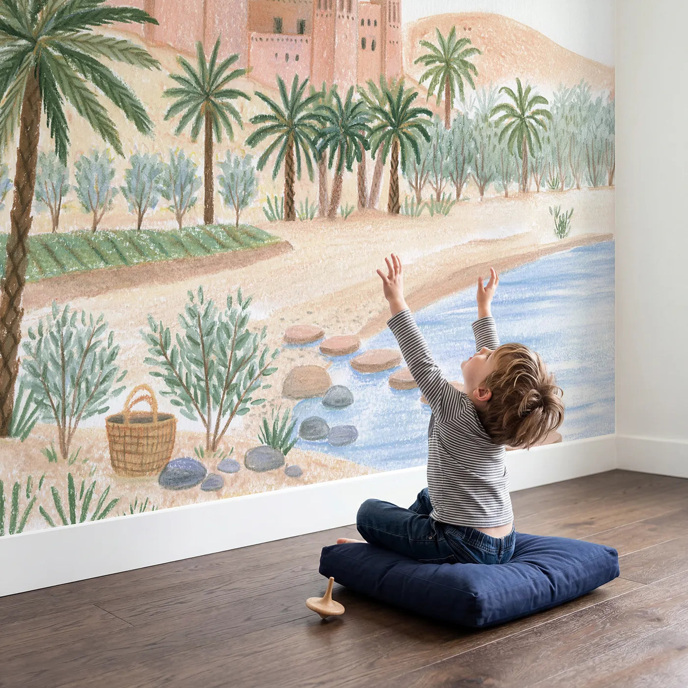 Child in nursery with The Desert Kasbah Wallpaper Mural by Whimsy Tots