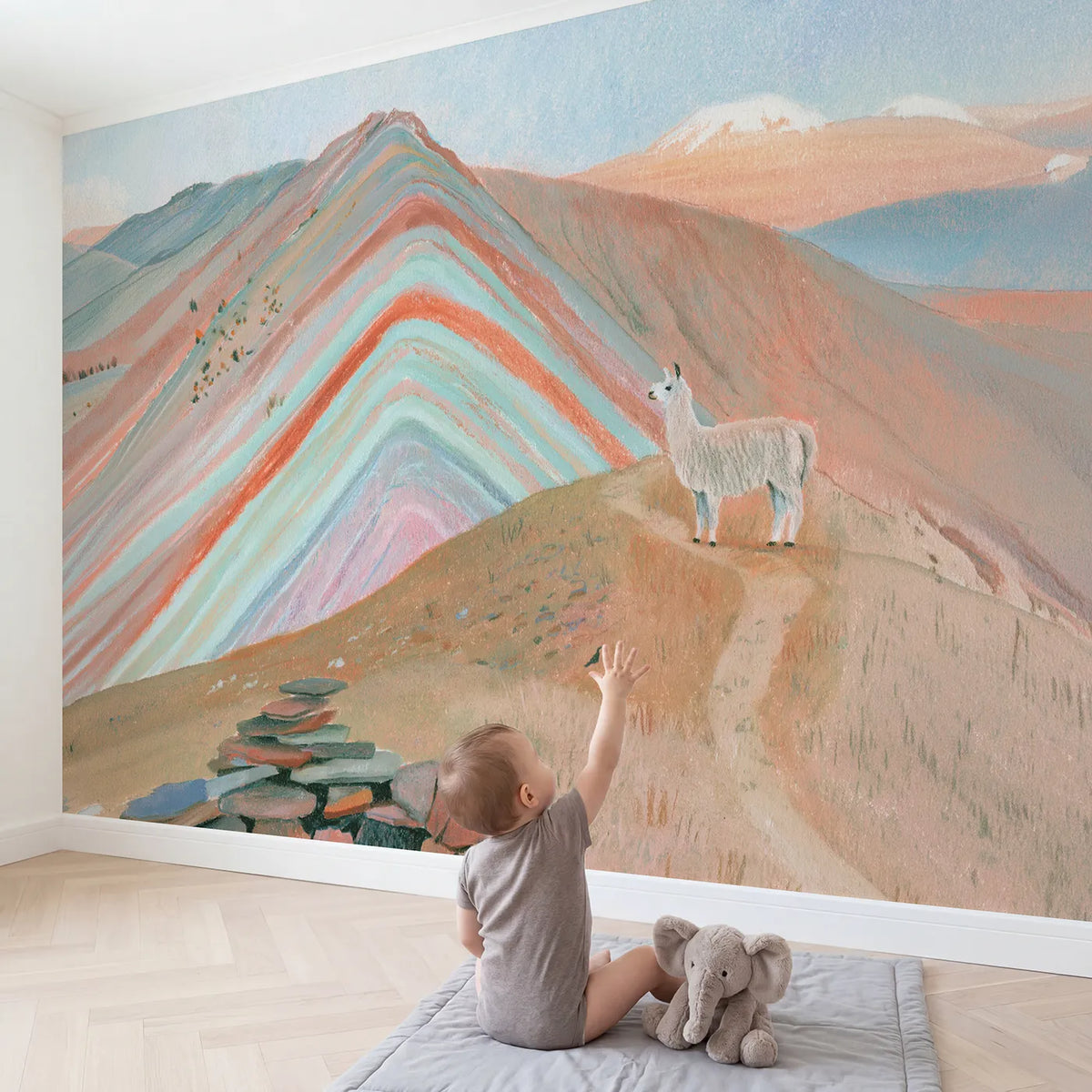 Child in nursery with The Rainbow Mountain Wallpaper Mural by Whimsy Tots
