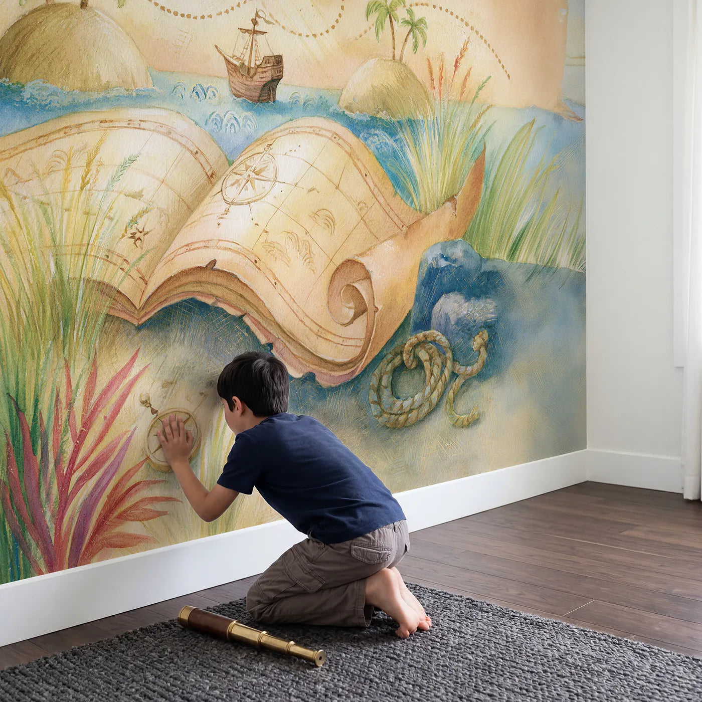 Child in nursery with Great Voyage Map Wallpaper Mural by Whimsy Tots