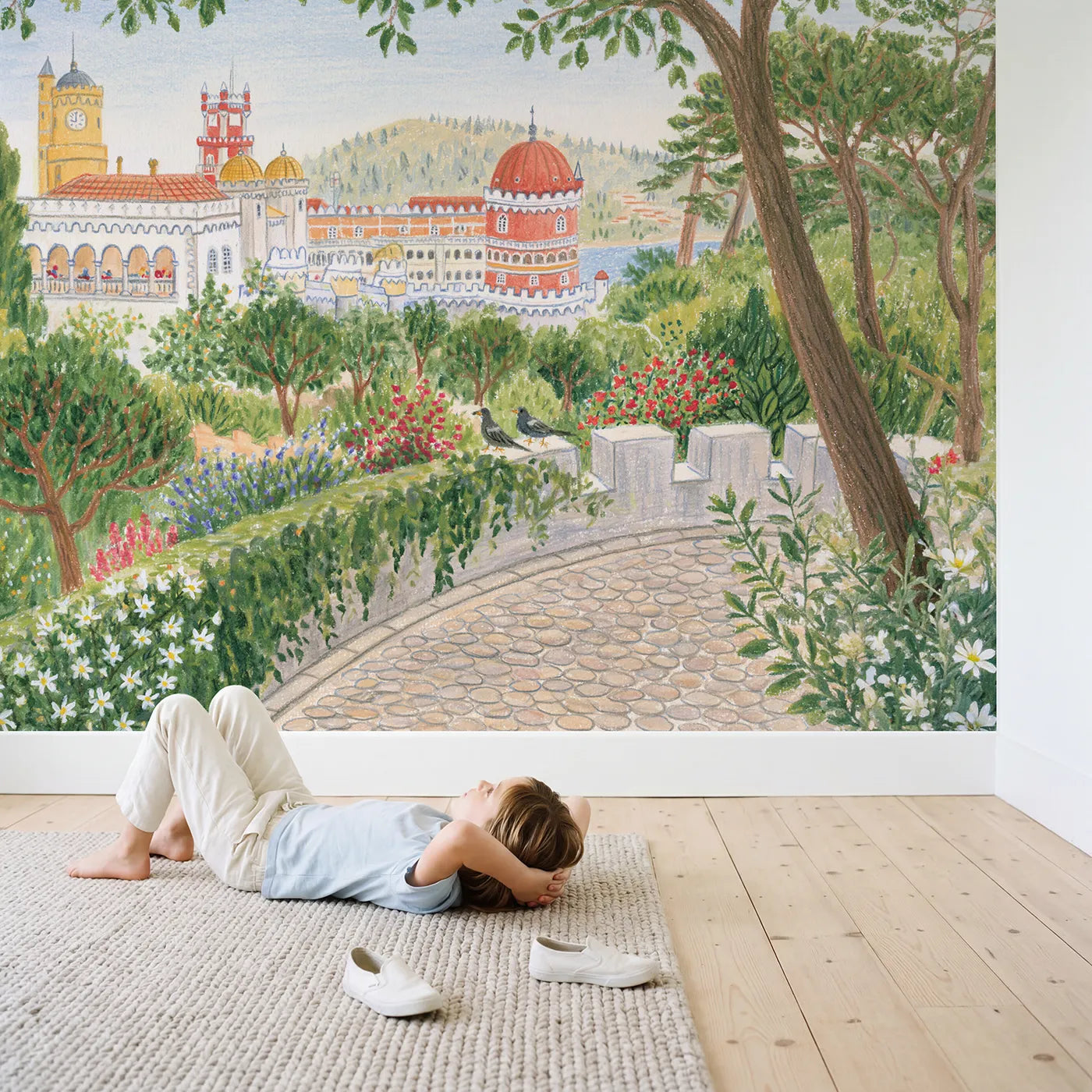 Child in nursery with The Painted Palace of Sintra Wallpaper Mural by Whimsy Tots