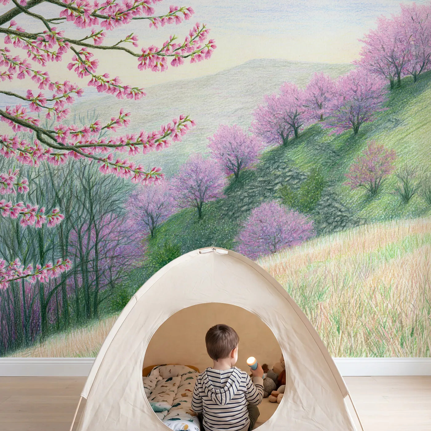 Child in nursery with Cherry Blossom Hillside Wallpaper Mural by Whimsy Tots