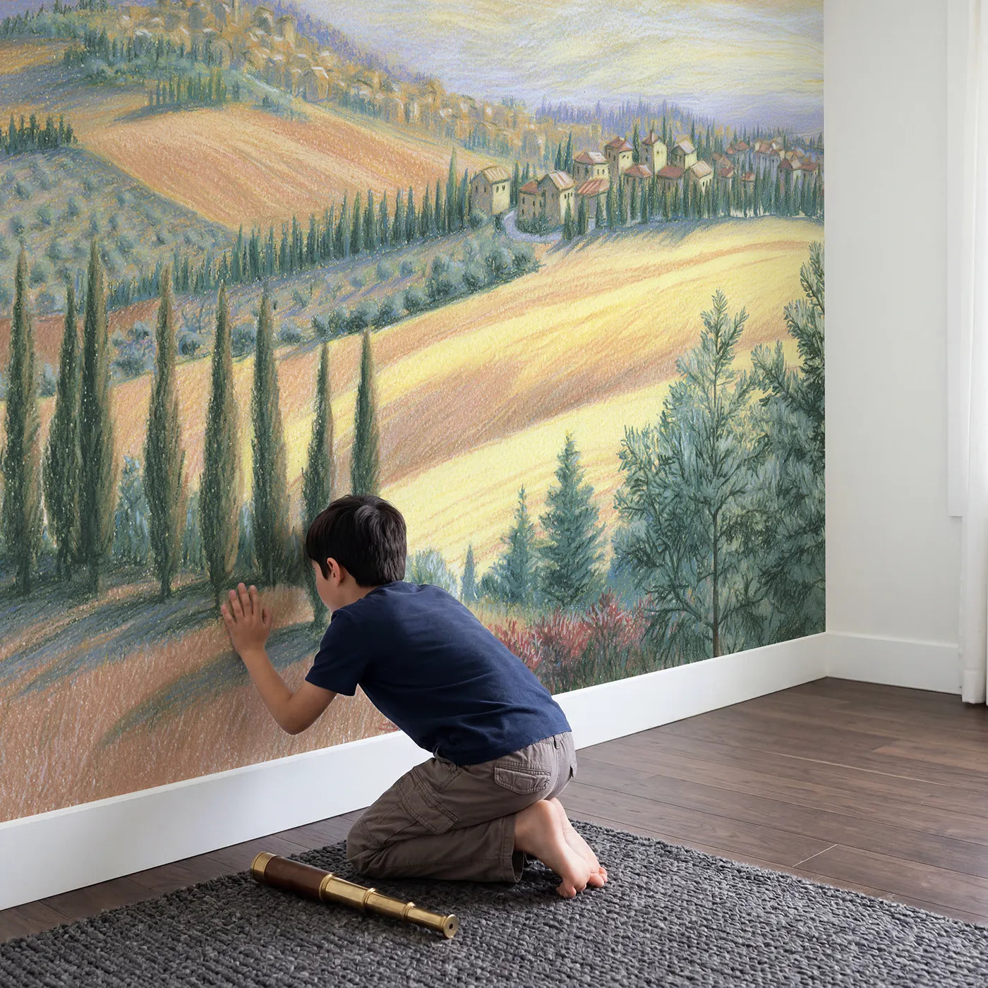 Child in nursery with Tuscan Hill Town Wallpaper Mural by Whimsy Tots