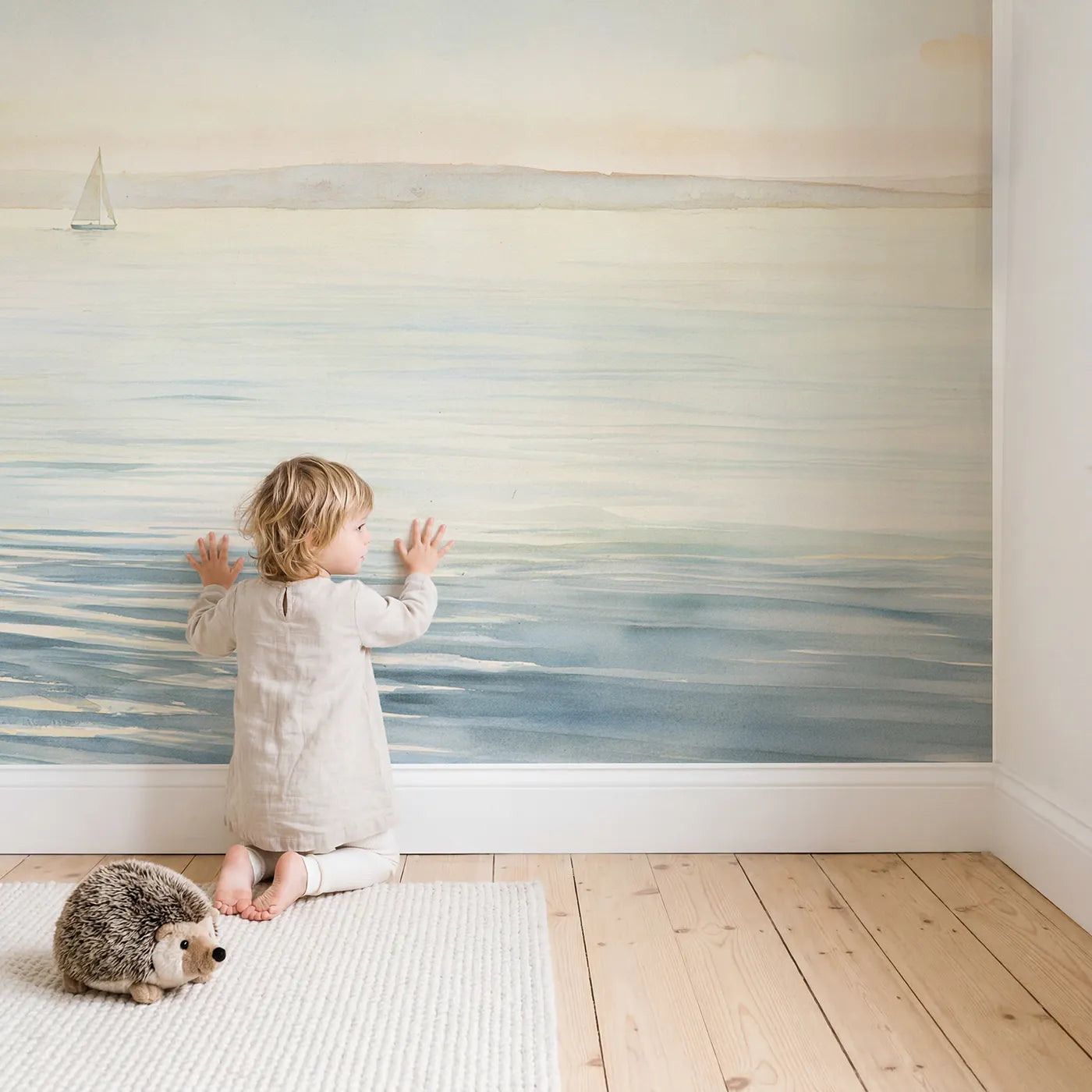 Child in nursery with Soft Sea Horizon Wallpaper Mural by Whimsy Tots