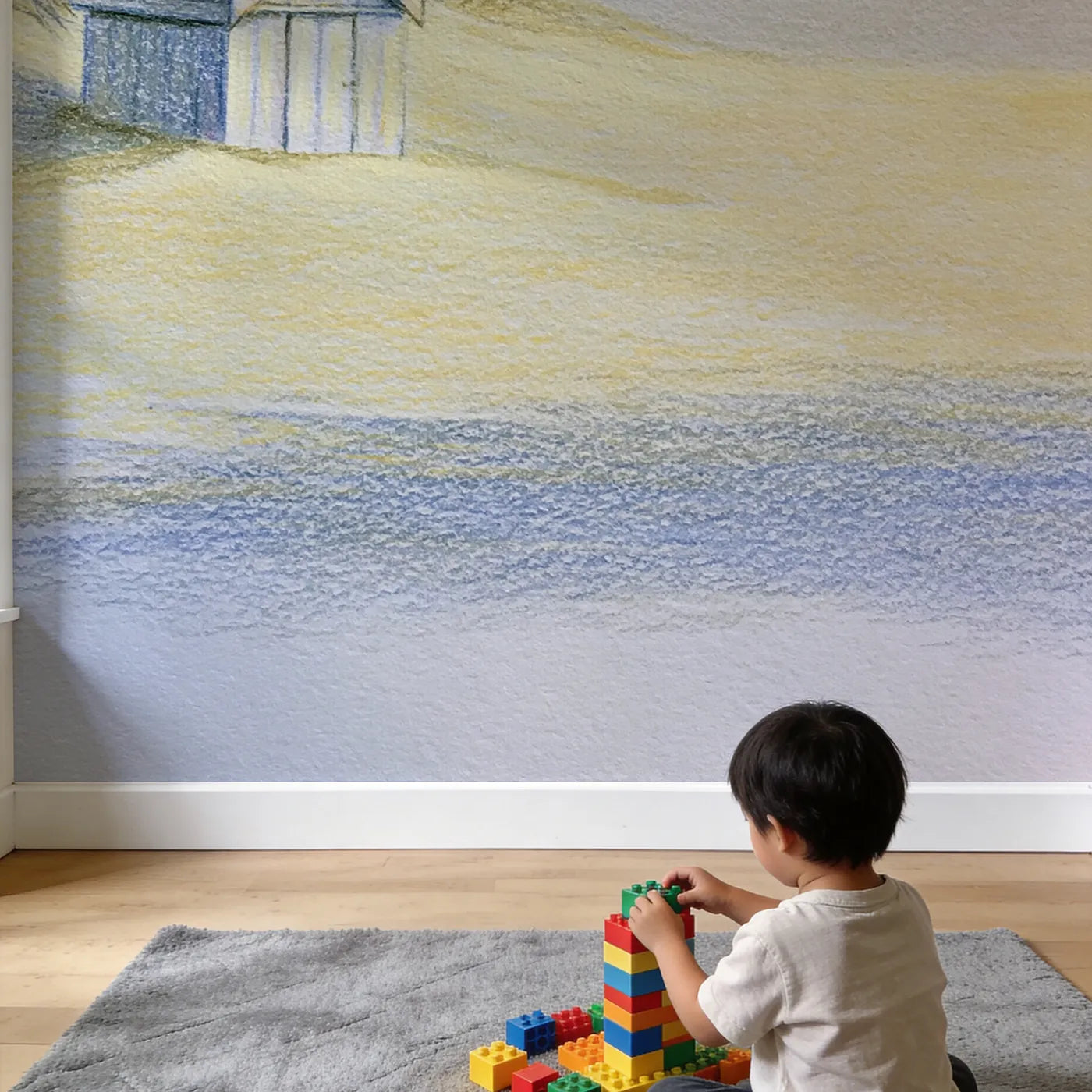 Child in nursery with Cozy Beach Hut Wallpaper Mural by Whimsy Tots