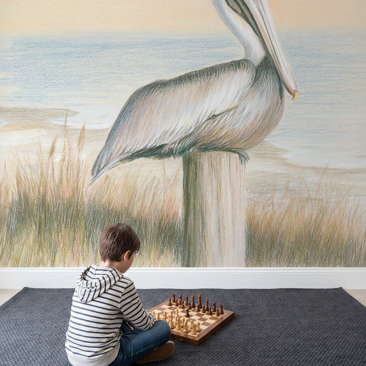 Child in nursery with Gentle Pelican Wallpaper Mural by Whimsy Tots