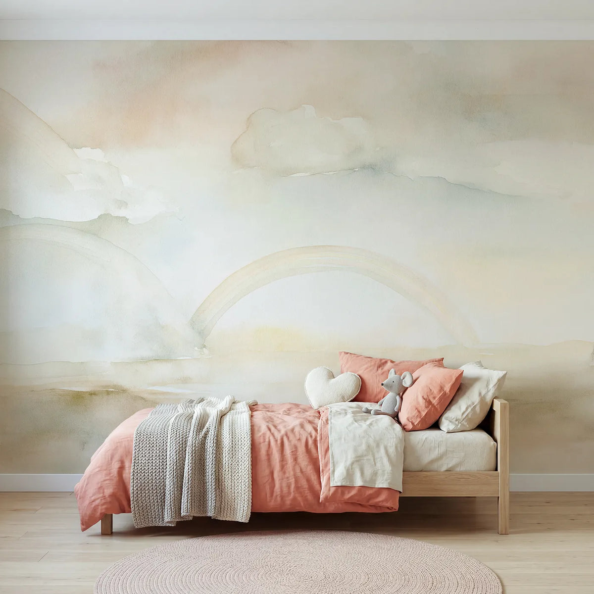 Watercolor wall mural of clouds cradling a rainbow by Whimsy Tots