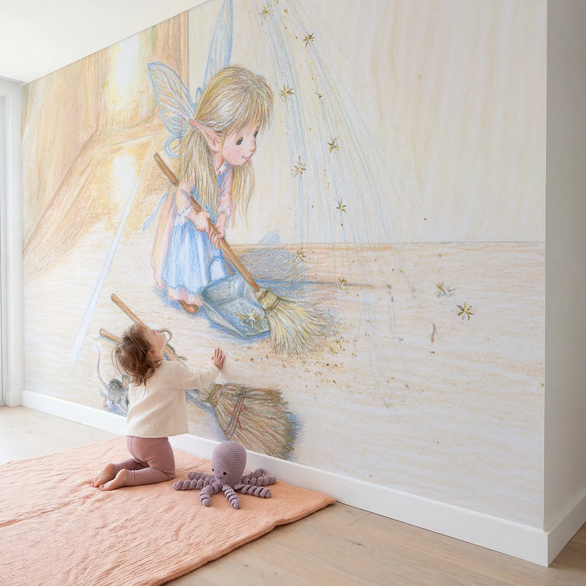 Child in nursery with The Sparkle Sweeper Wallpaper Mural by Whimsy Tots