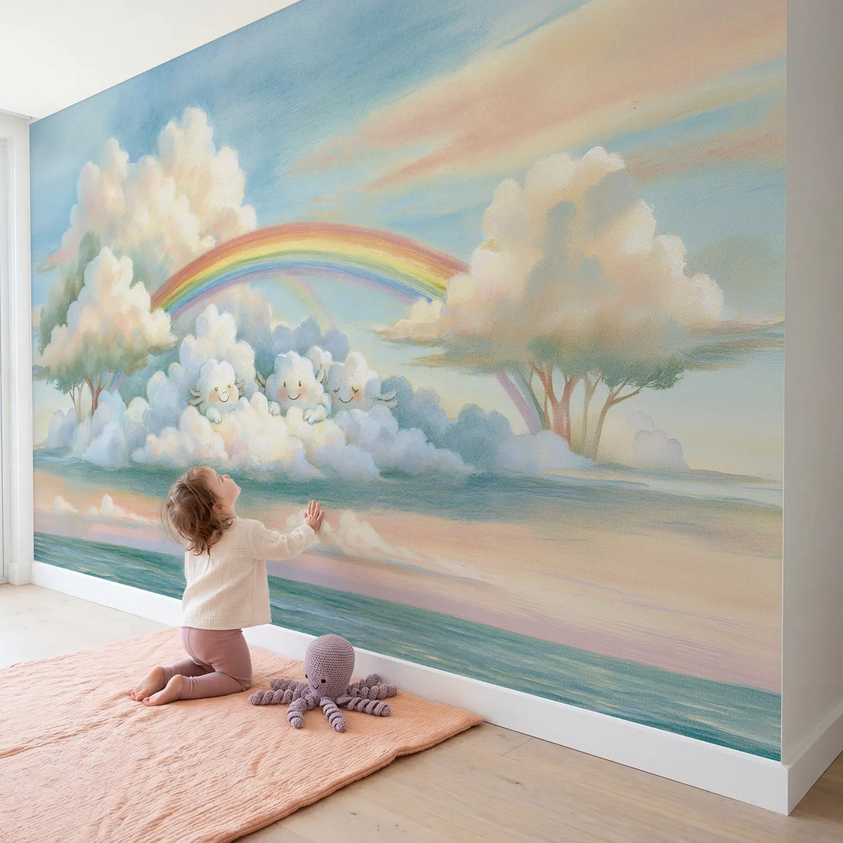 Child in nursery with Rainbow Cloud Friends Wallpaper Mural by Whimsy Tots