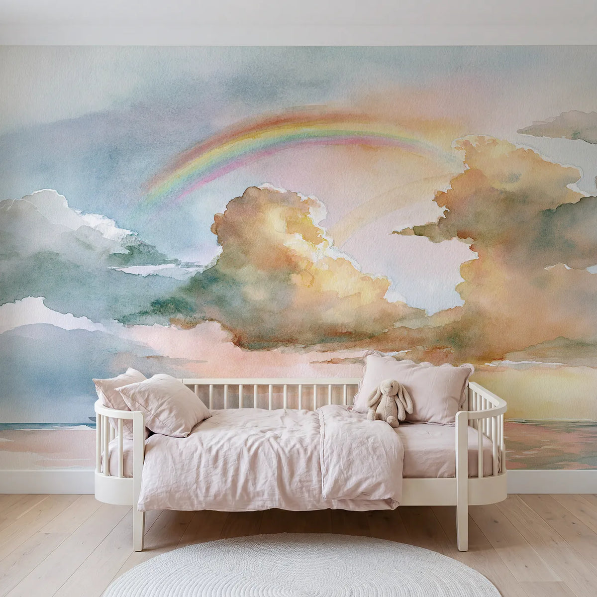 Watercolor wall mural of a soft cloud and faint rainbow by Whimsy Tots