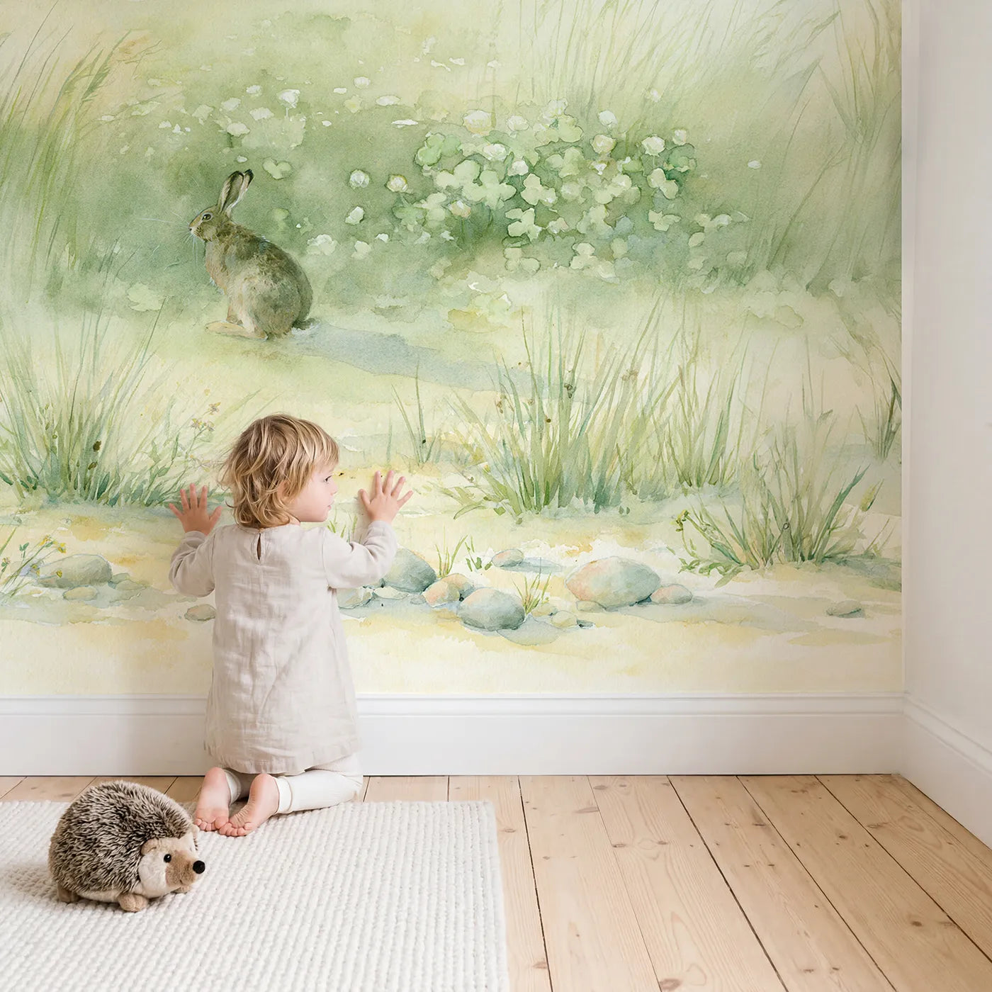 Child in nursery with Hazy Hare Meadow Wallpaper Mural by Whimsy Tots