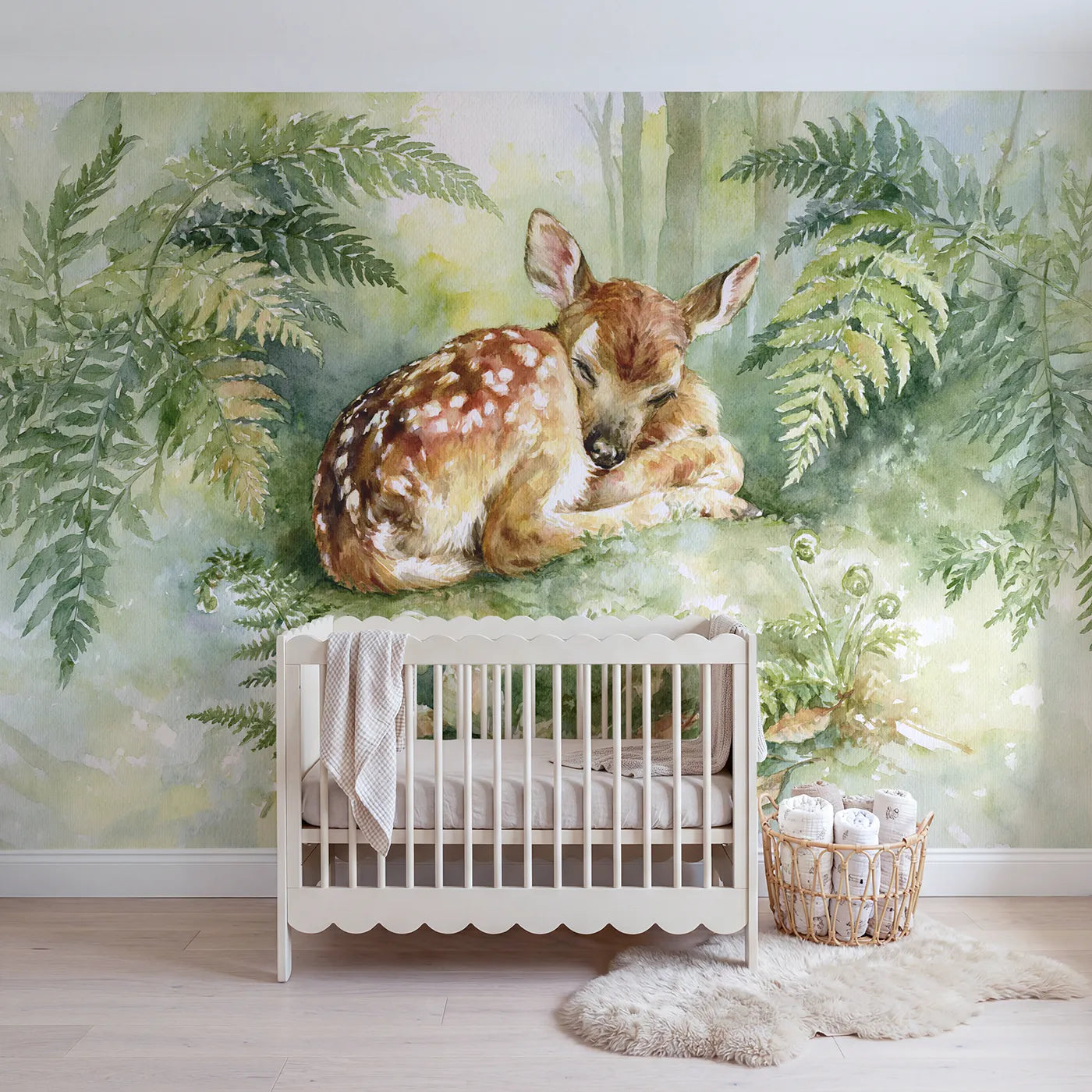 Watercolor wall mural of a resting spotted fawn by Whimsy Tots