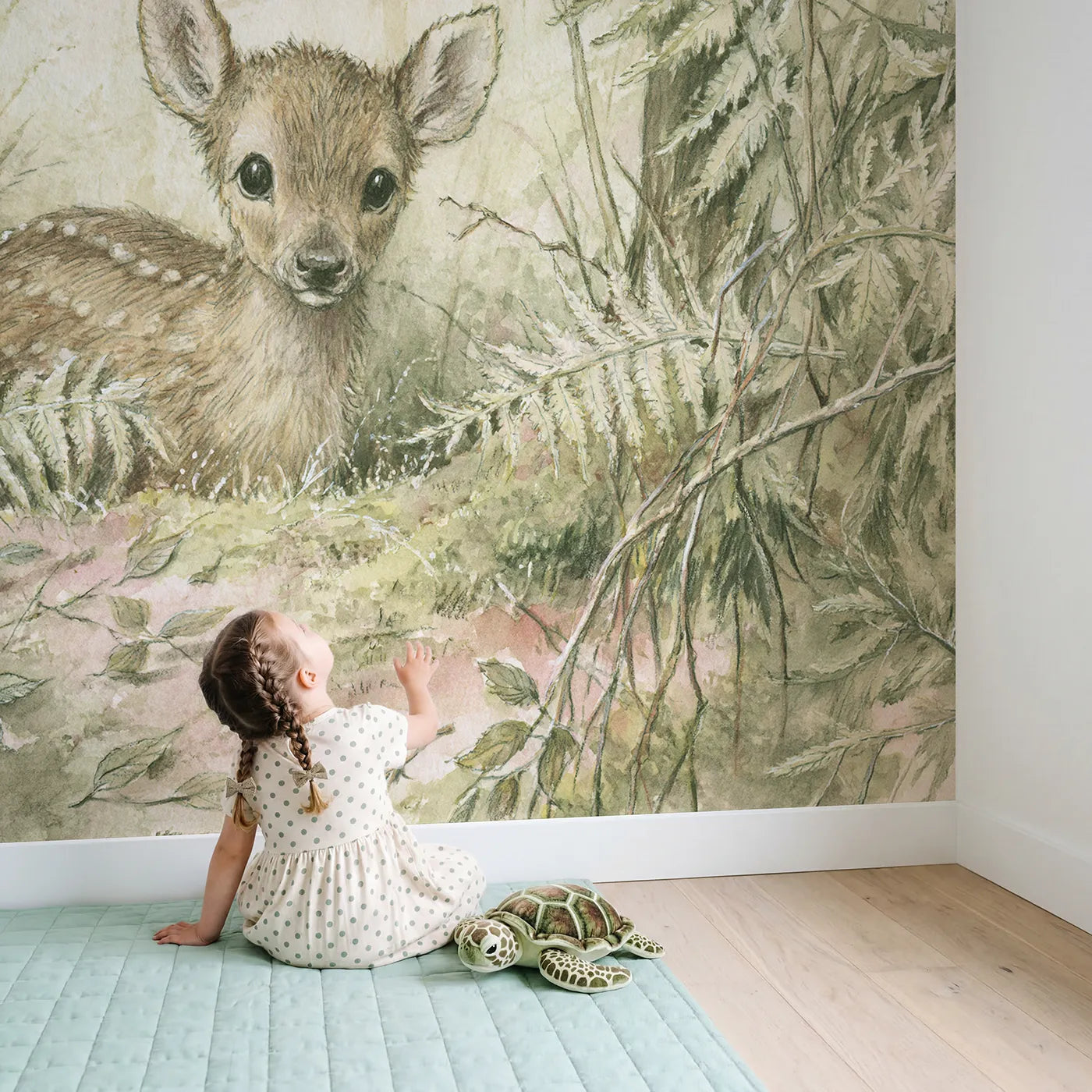 Child in nursery with Curious Little Deer Wallpaper Mural by Whimsy Tots