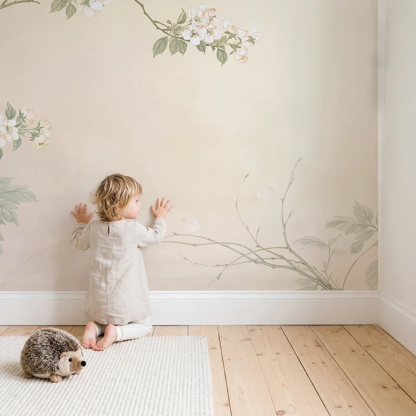 Child in nursery with Goldfinch Apple Bloom Wallpaper Mural by Whimsy Tots