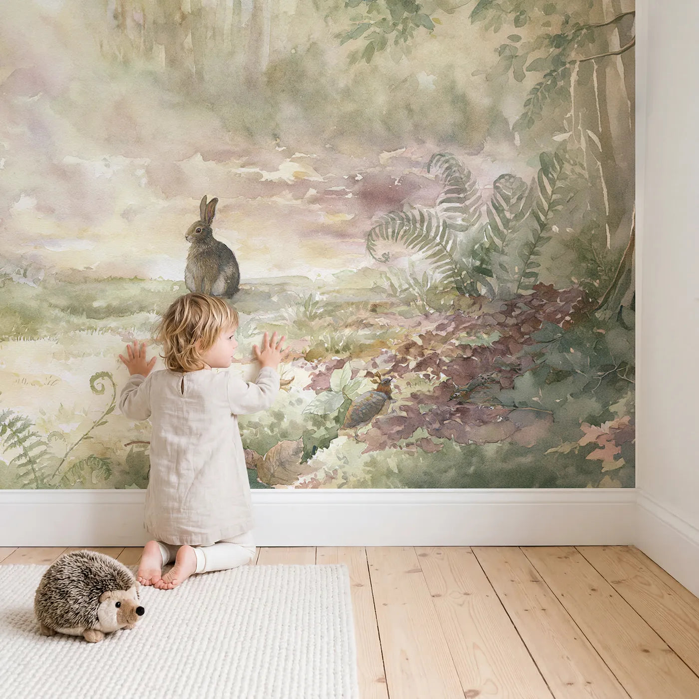 Child in nursery with Dawn Glade Rabbit Wallpaper Mural by Whimsy Tots