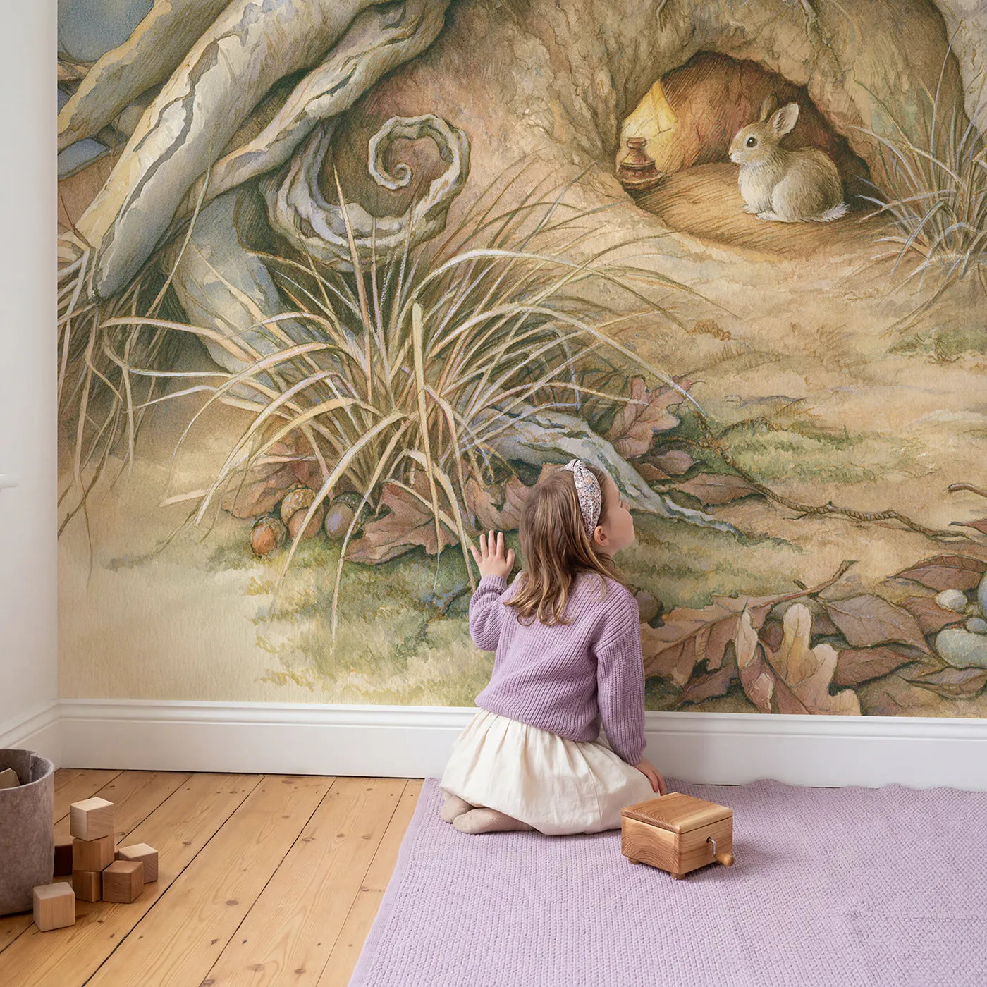Child in nursery with Hidden Burrow Home Wallpaper Mural by Whimsy Tots