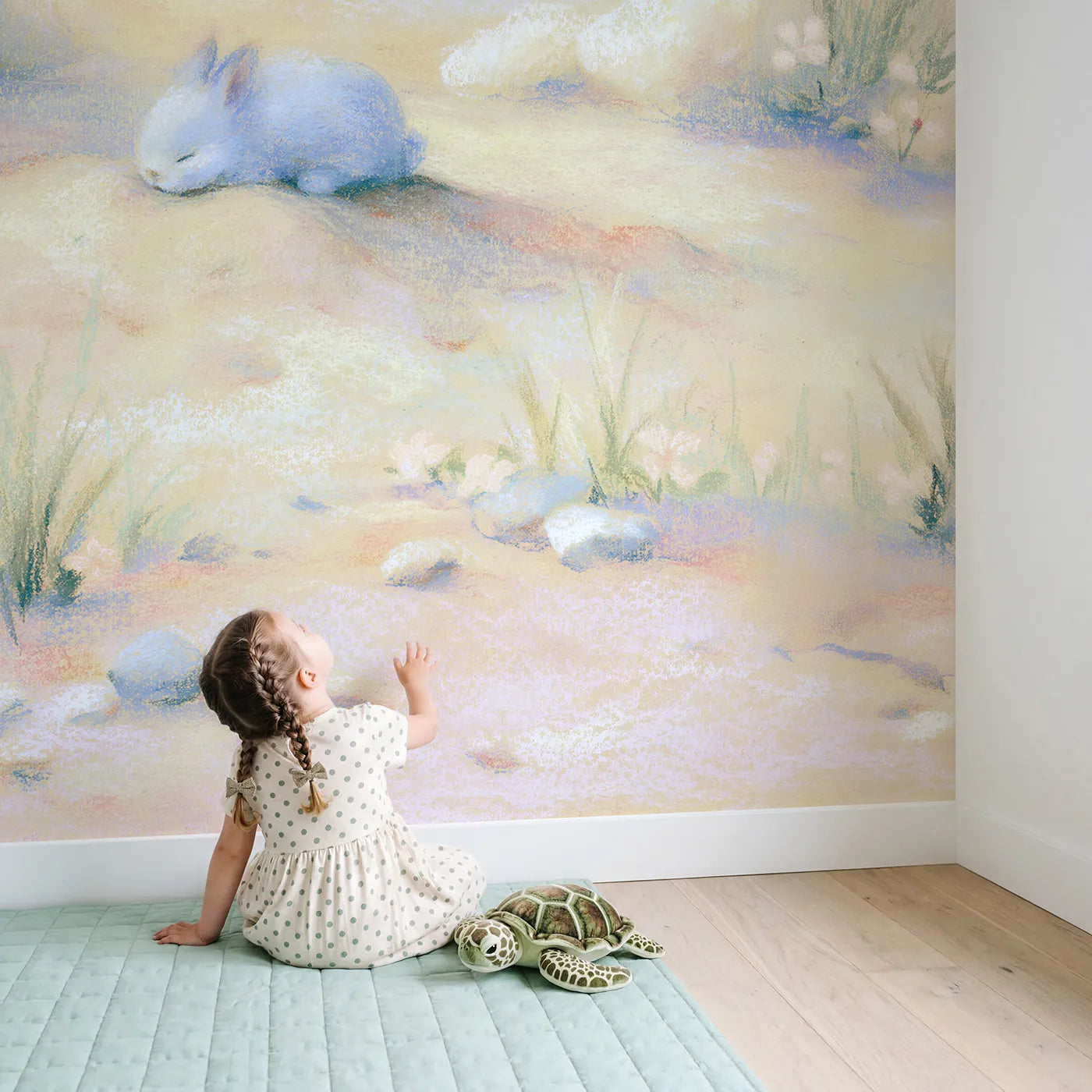 Child in nursery with Gentle Bunny Nap Wallpaper Mural by Whimsy Tots
