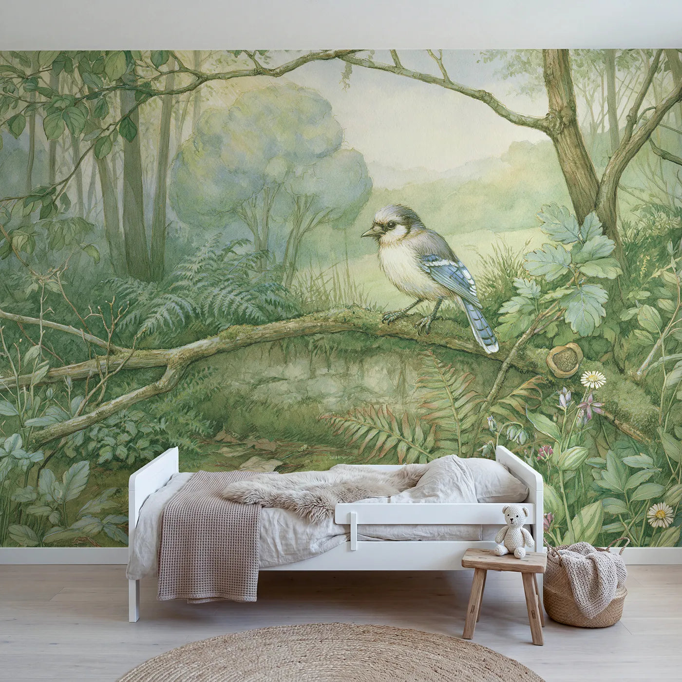 Woodland wall mural of a bright blue-flashed forest jay by Whimsy Tots