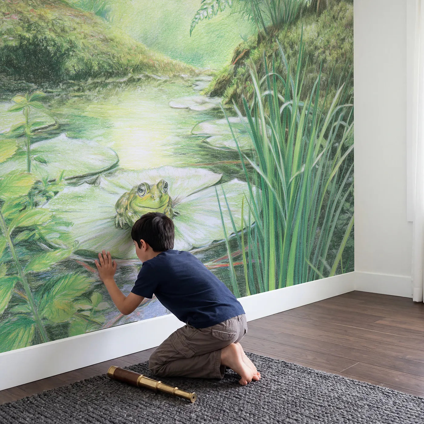 Child in nursery with Little Forest Frog Wallpaper Mural by Whimsy Tots