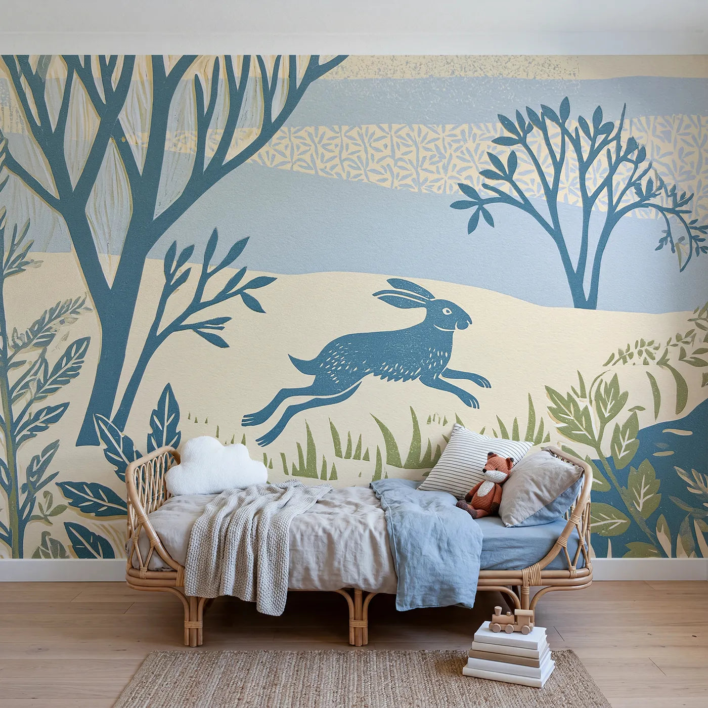 Linocut wall mural of a hopping rabbit in dusty-blue ink by Whimsy Tots