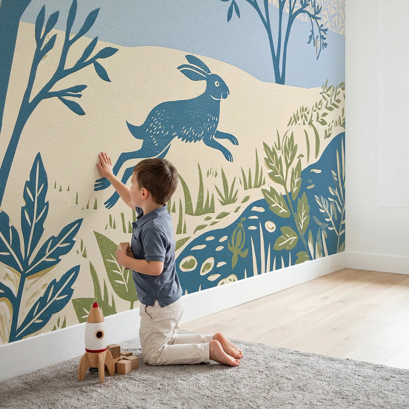 Child in nursery with Linocut Rabbit Hop Wallpaper Mural by Whimsy Tots