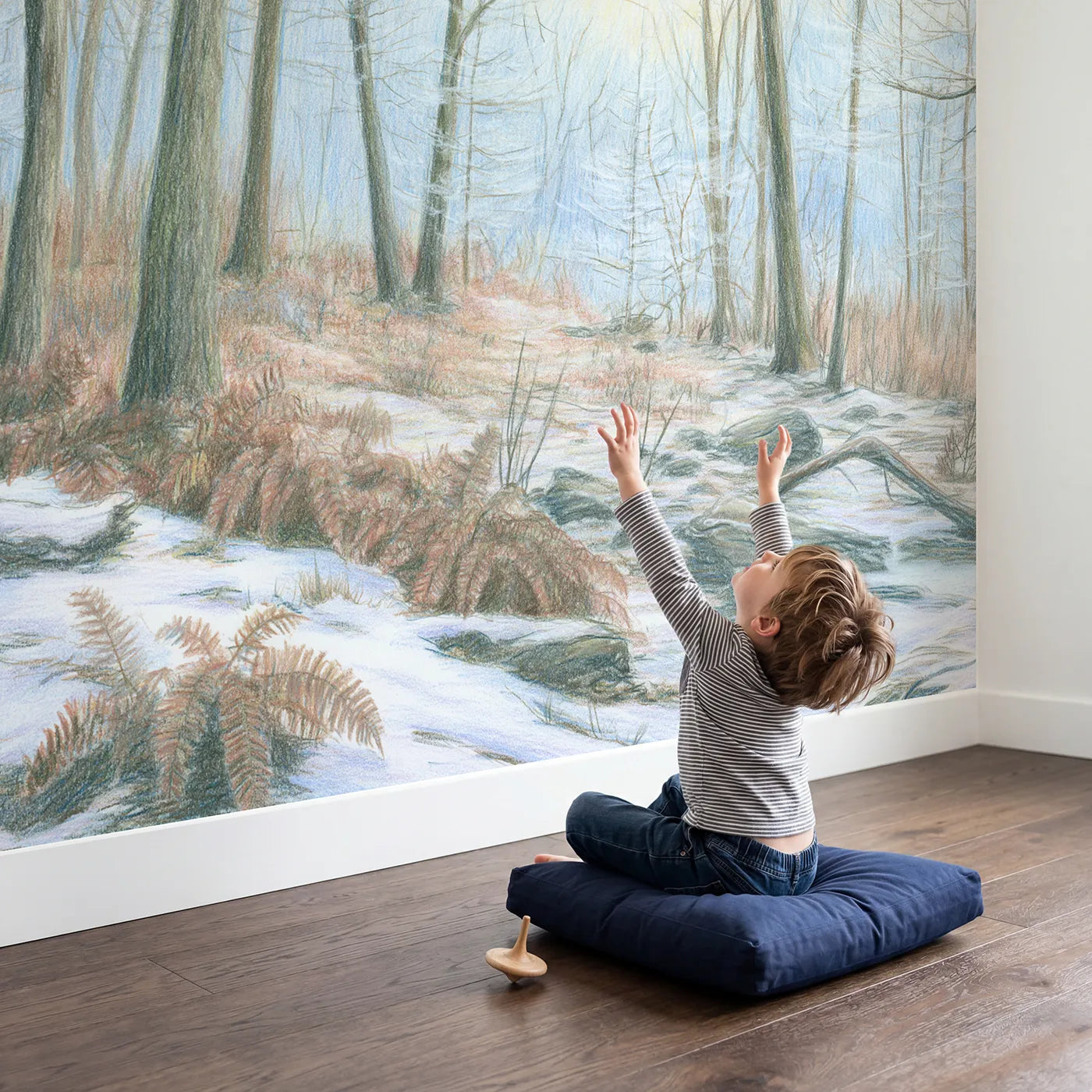 Child in nursery with Snowy Winter Woodland Wallpaper Mural by Whimsy Tots
