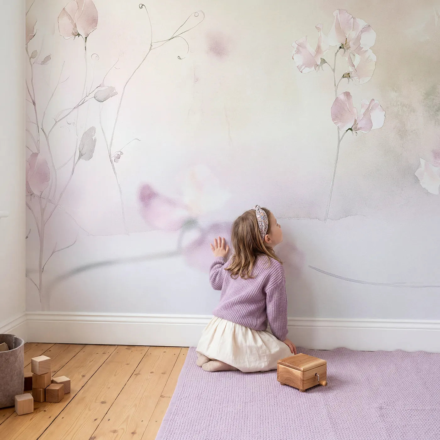 Child in nursery with Dreamy Sweet Pea Wallpaper Mural by Whimsy Tots
