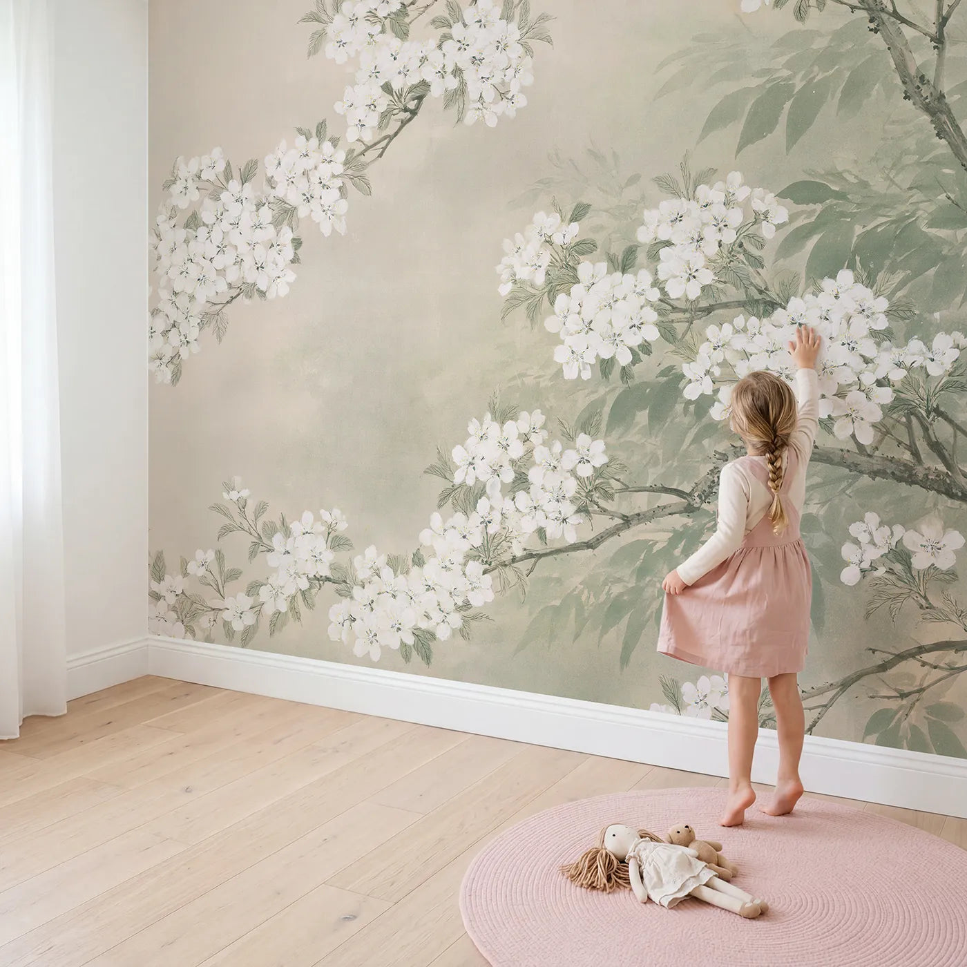 Child in nursery with The Apple Blossom Canopy Wallpaper Mural by Whimsy Tots
