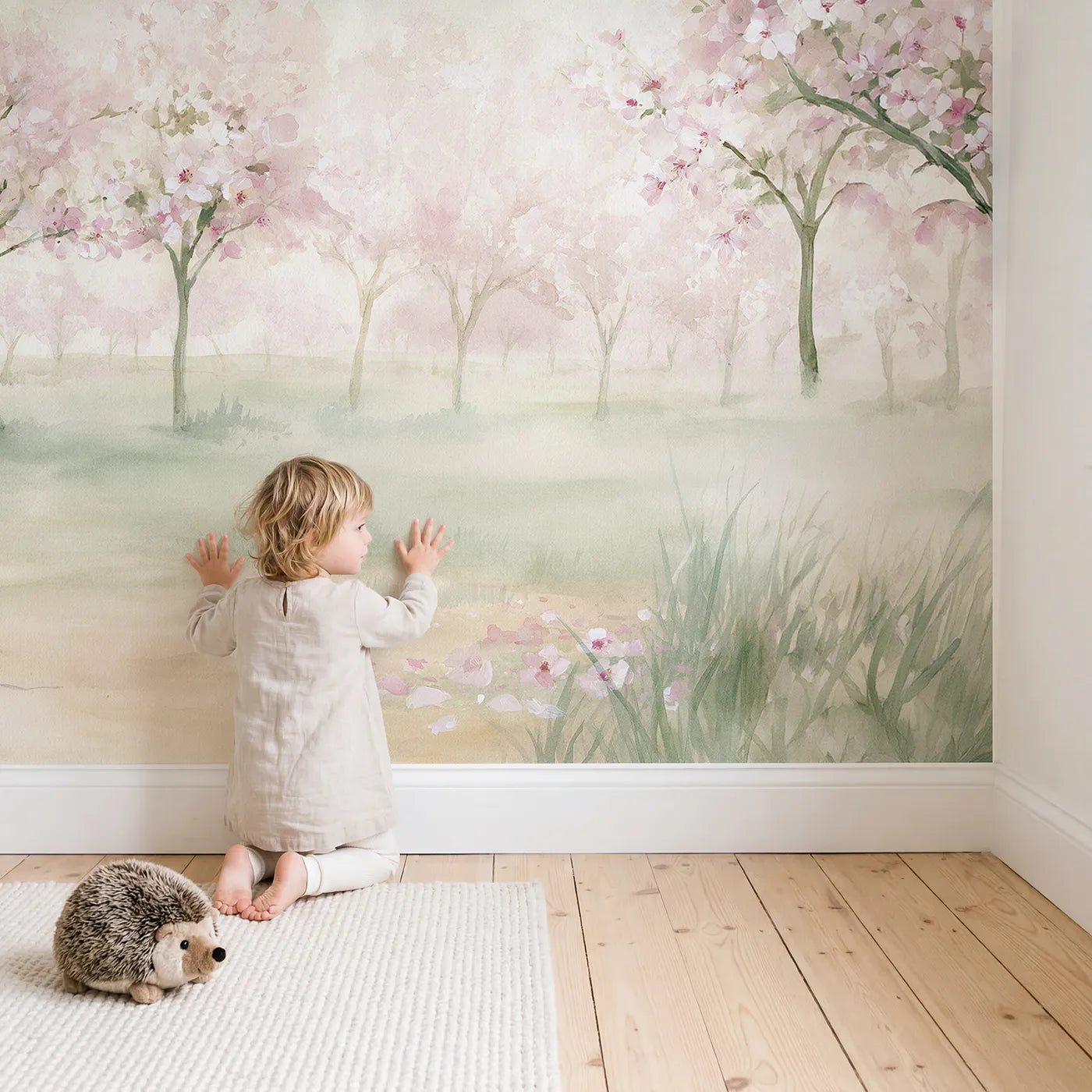 Child in nursery with Hazy Apple Orchard Wallpaper Mural by Whimsy Tots