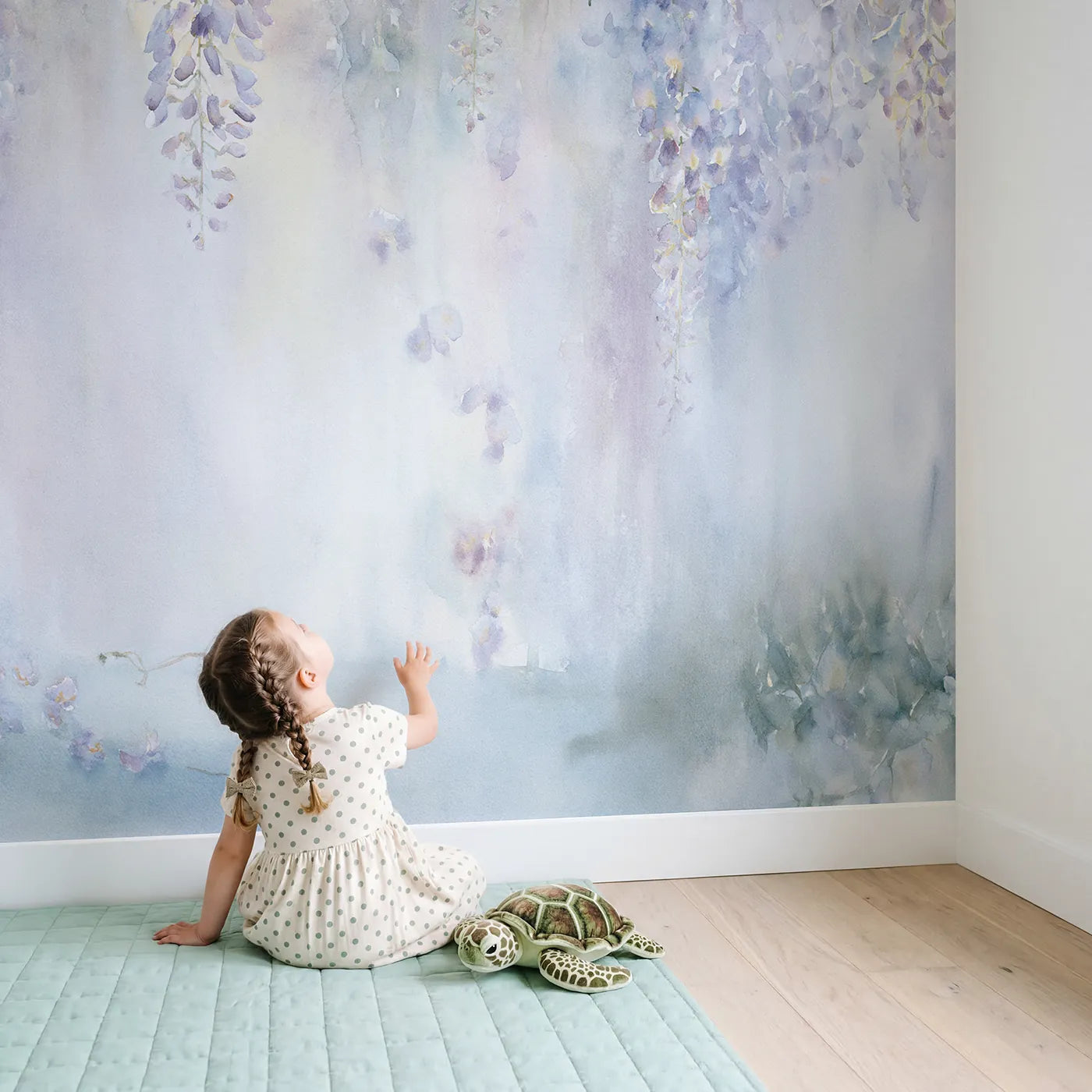 Child in nursery with Wisteria Soft Drift Wallpaper Mural by Whimsy Tots