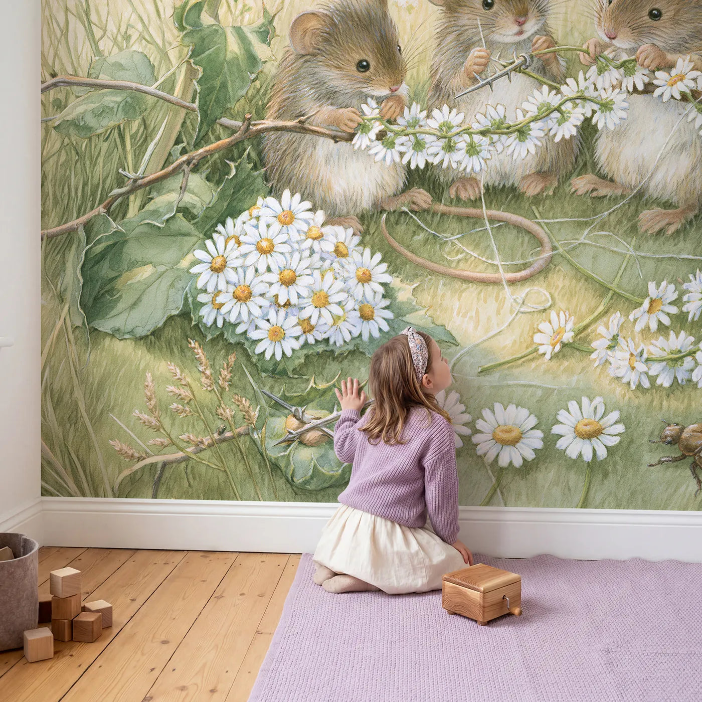 Child in nursery with The Daisy Chain Makers Wallpaper Mural by Whimsy Tots