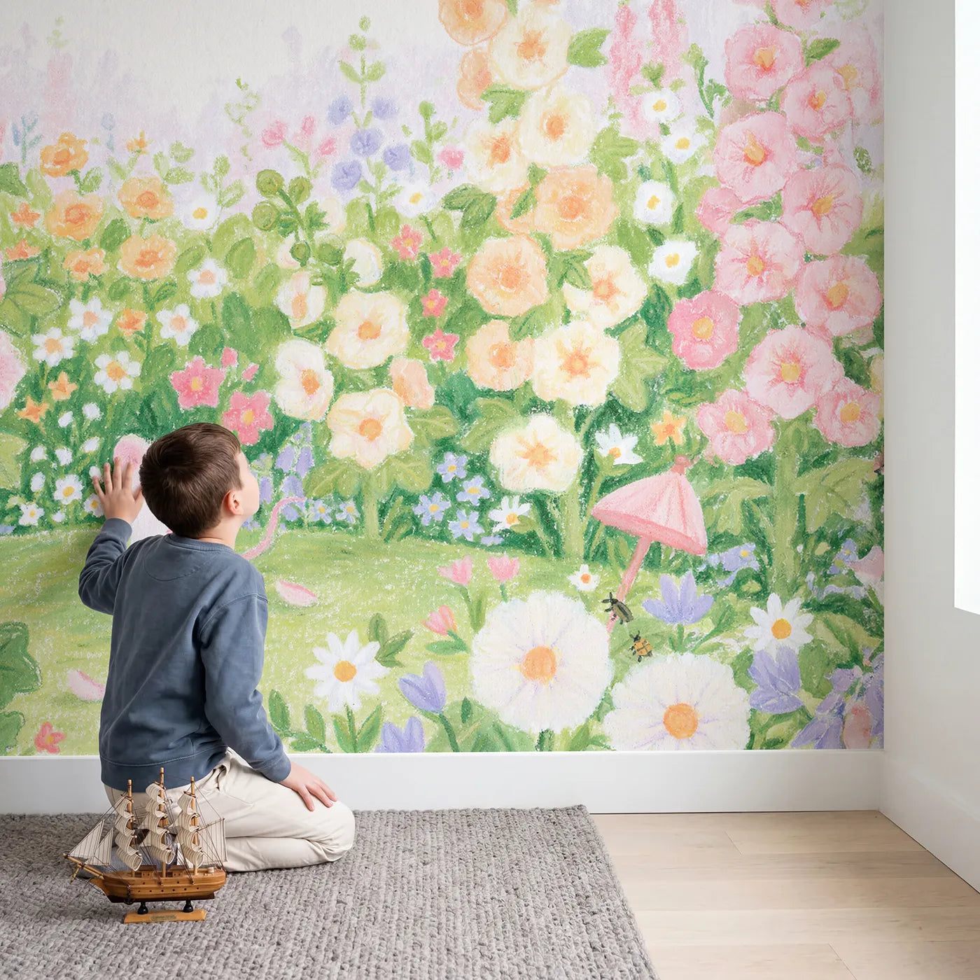 Child in nursery with The Hollyhock Towers Wallpaper Mural by Whimsy Tots