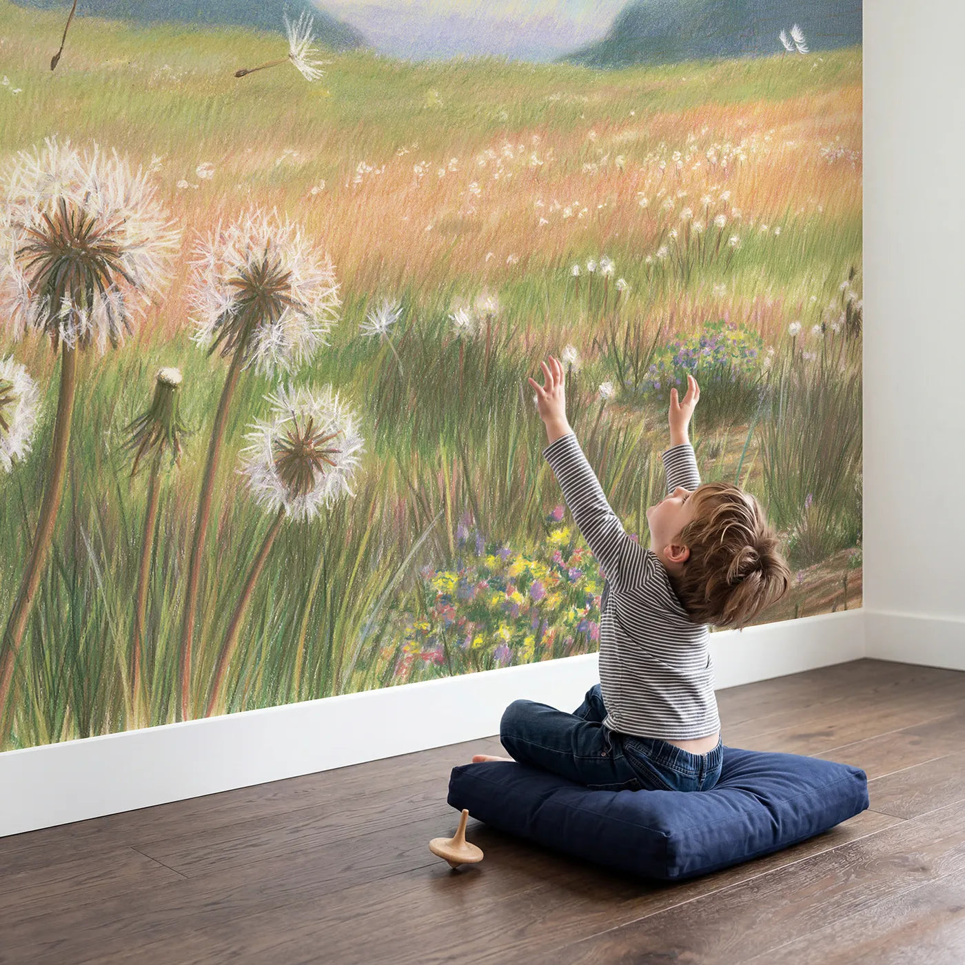 Child in nursery with Dandelion Seed Meadow Wallpaper Mural by Whimsy Tots