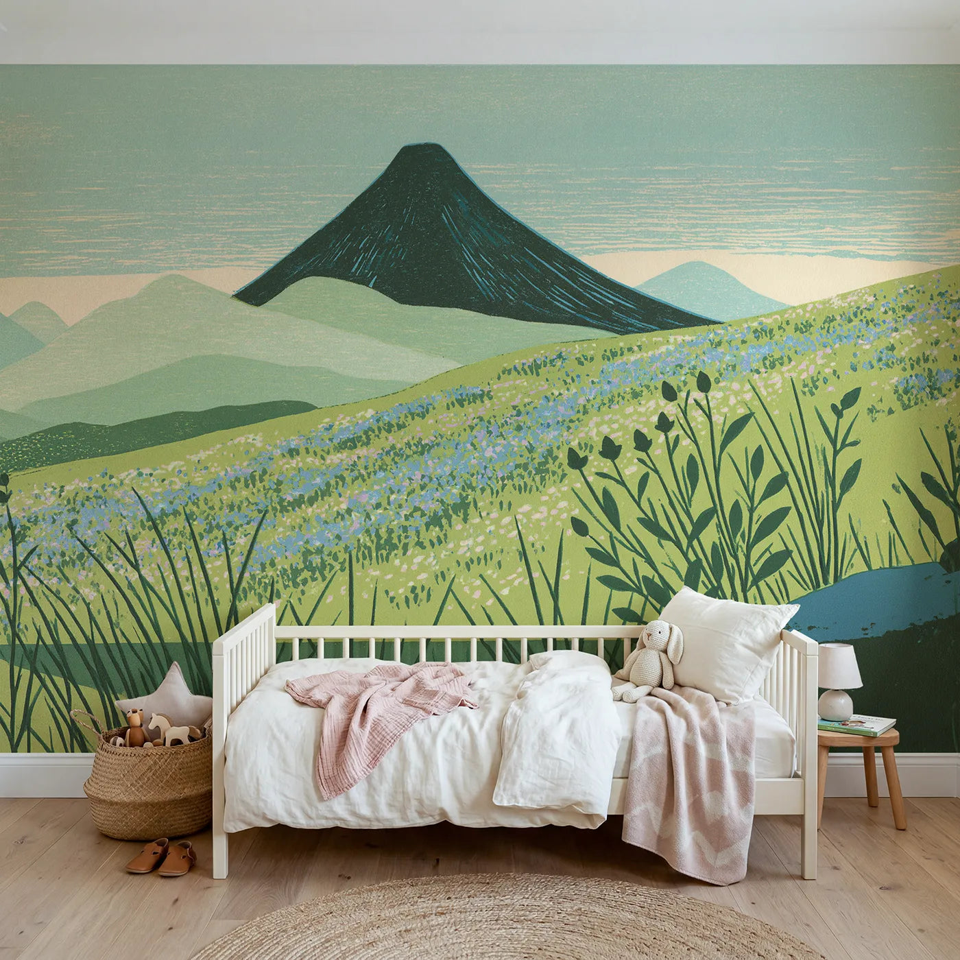 Linocut wall mural of a dusty-blue alpine ridge by Whimsy Tots