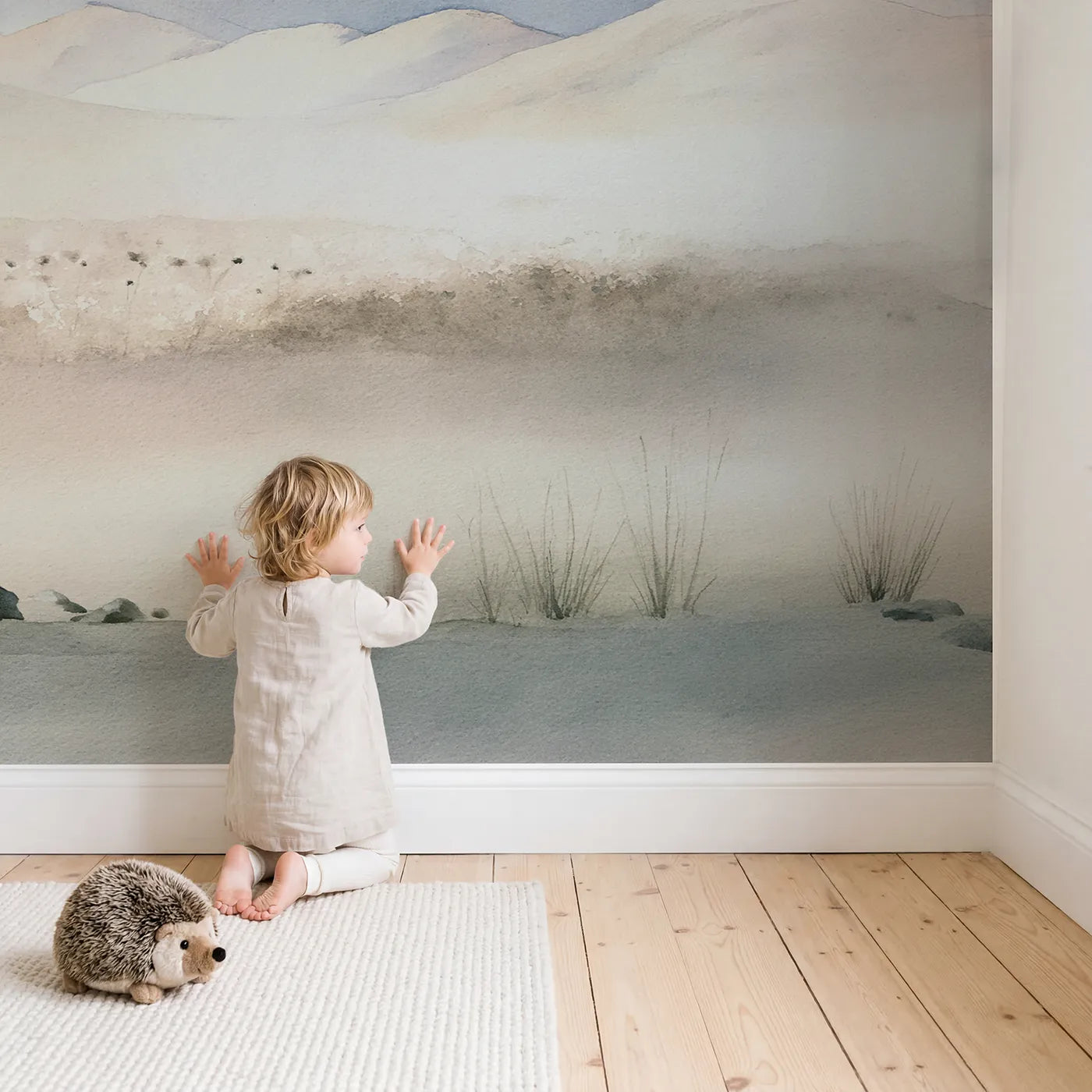 Child in nursery with Dawn Rolling Hills Blooms Wallpaper Mural by Whimsy Tots