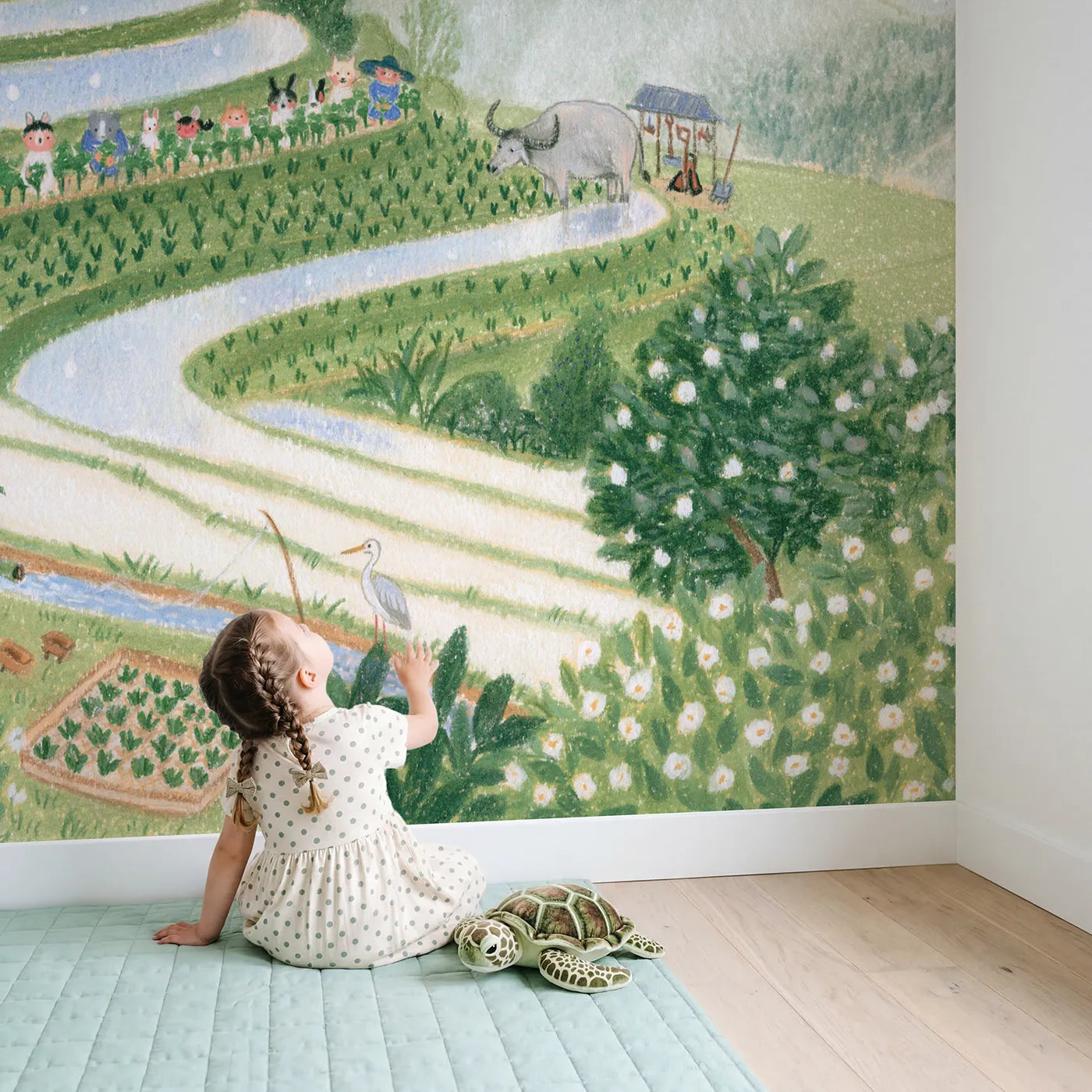 Child in nursery with Planting the Terraces Wallpaper Mural by Whimsy Tots
