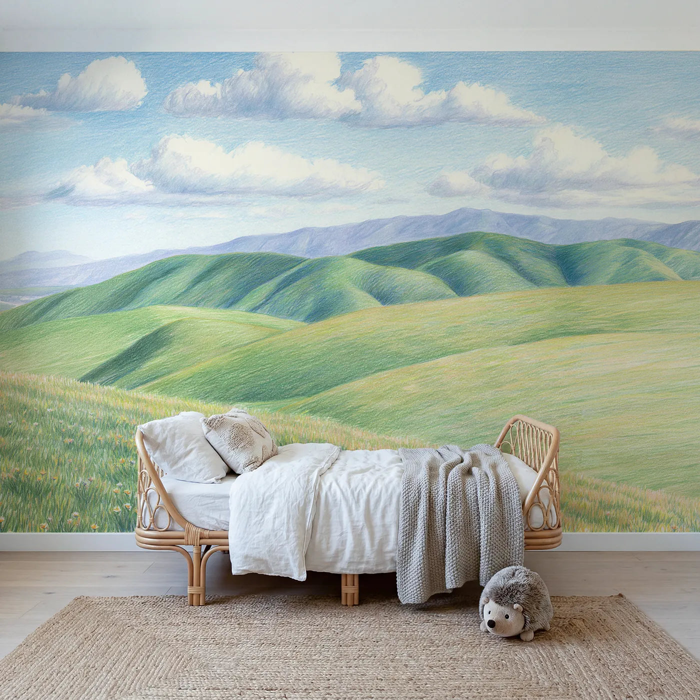 Colored-pencil wall mural of foothills under a wide sky by Whimsy Tots