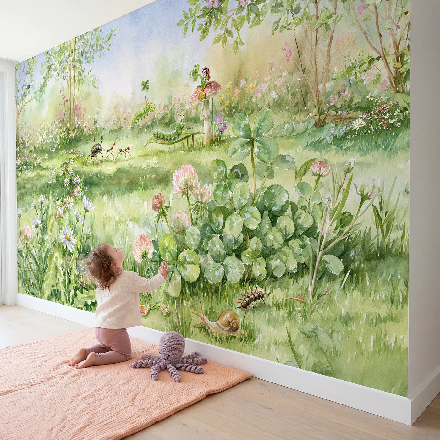 Child in nursery with The Bug Sports Day Wallpaper Mural by Whimsy Tots