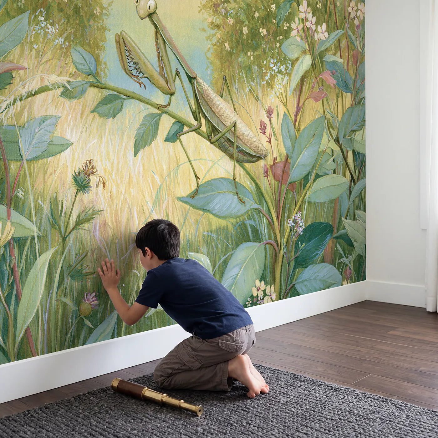 Child in nursery with Gentle Praying Mantis Wallpaper Mural by Whimsy Tots