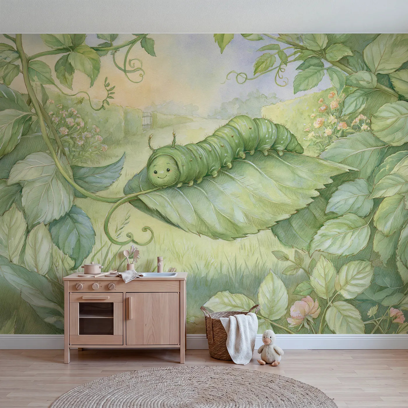 Garden wall mural of a cheerful little inchworm by Whimsy Tots