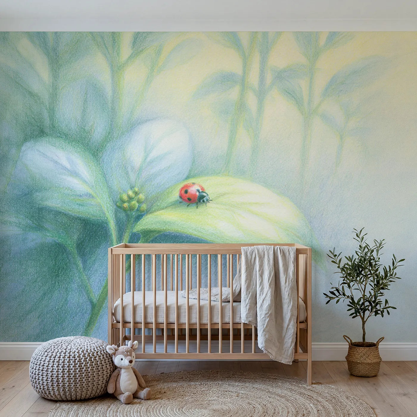 Colored-pencil wall mural of a ladybug on a drawn leaf by Whimsy Tots