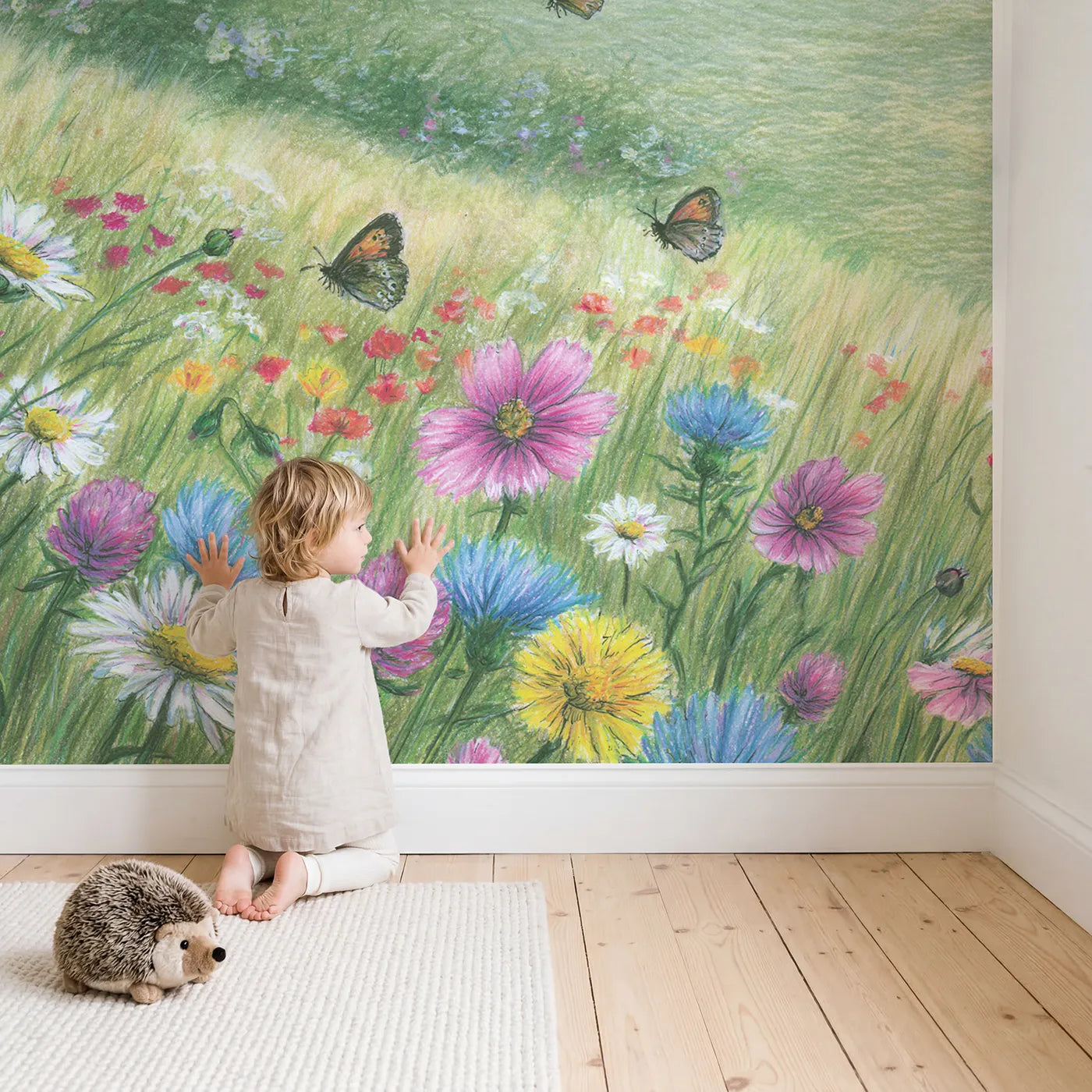 Child in nursery with Butterflies over Wildflowers Wallpaper Mural by Whimsy Tots