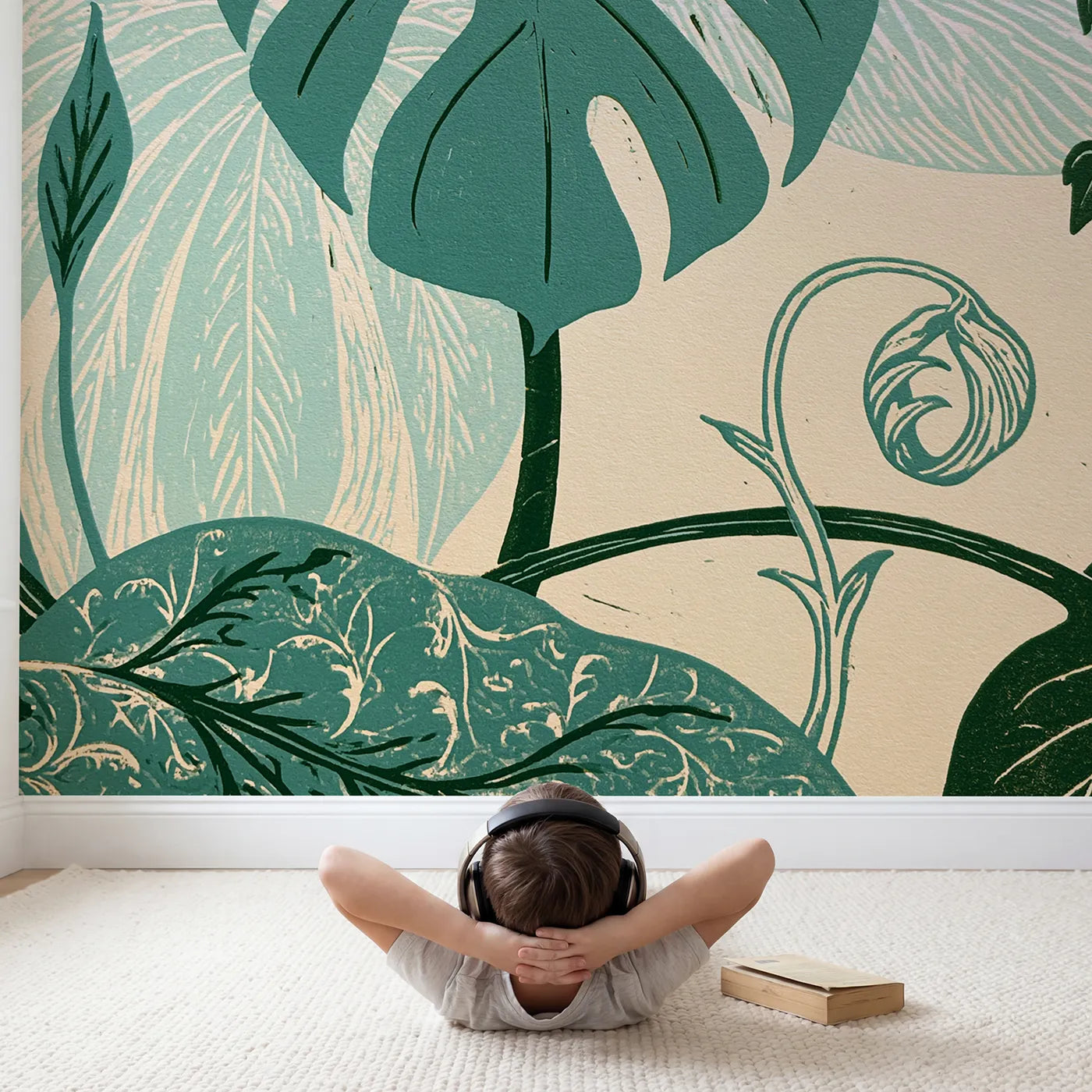 Child in nursery with Linocut Monstera Leaf Wallpaper Mural by Whimsy Tots