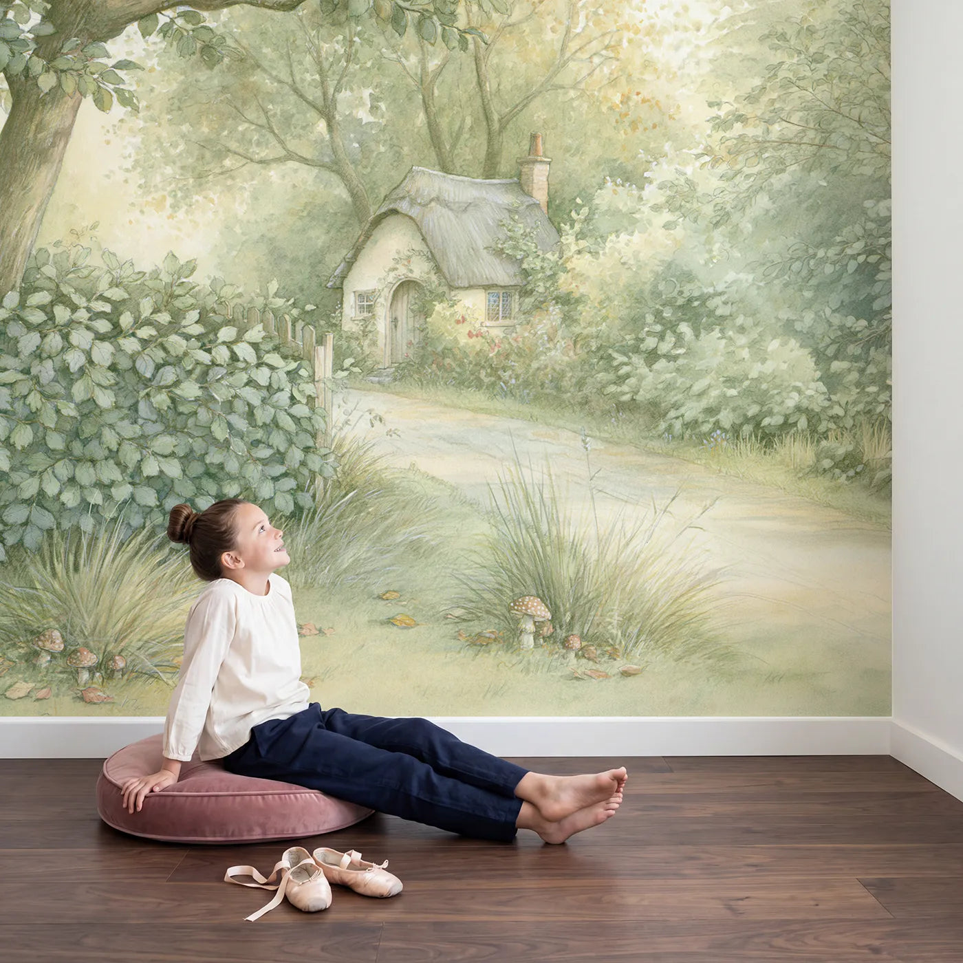 Child in nursery with Hedgerow Cottage Lane Wallpaper Mural by Whimsy Tots