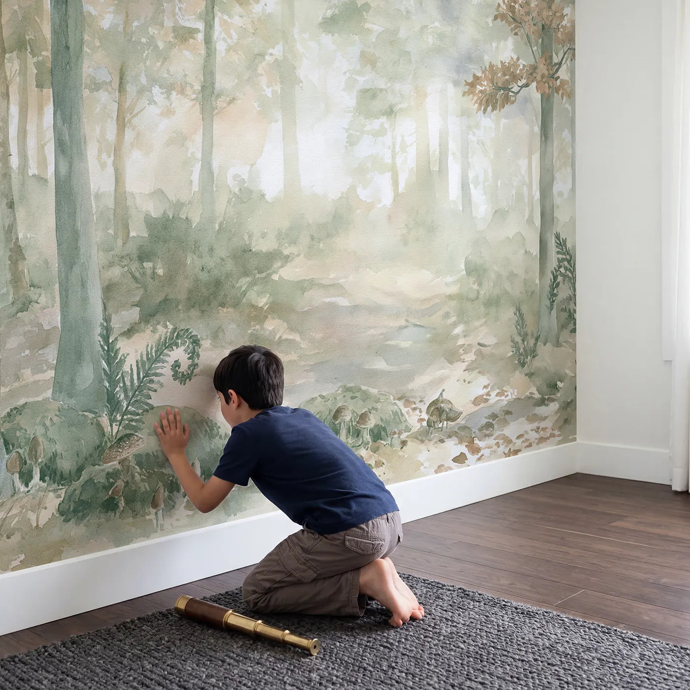 Child in nursery with Misty Woodland Nook Wallpaper Mural by Whimsy Tots