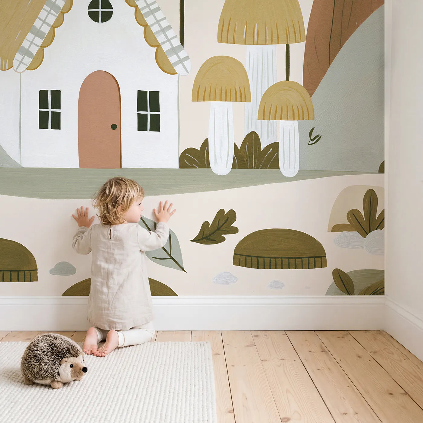 Child in nursery with Folk Check Cottage Wallpaper Mural by Whimsy Tots
