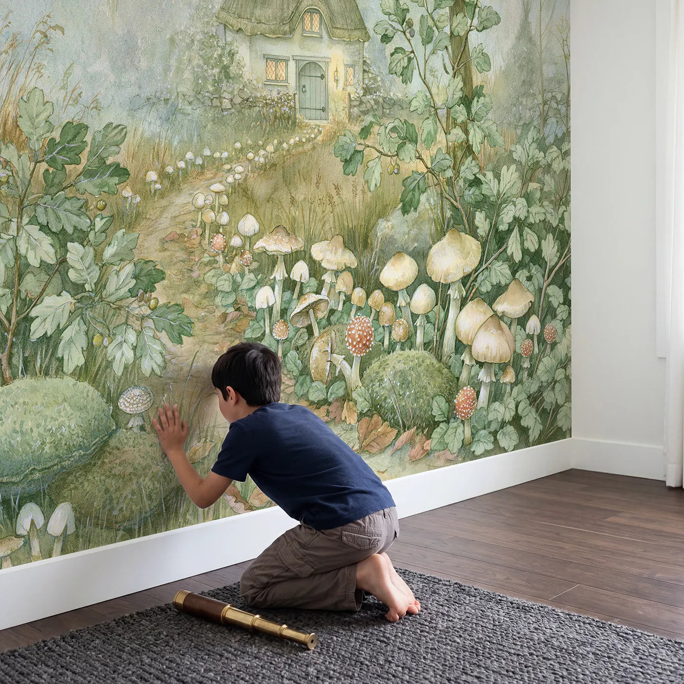 Child in nursery with Toadstool Cottage Lane Wallpaper Mural by Whimsy Tots